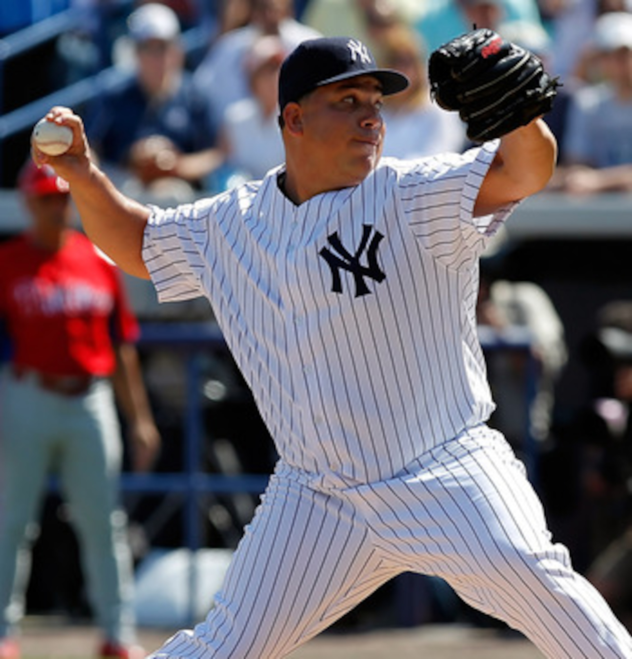 TAMPA, FL - FEBRUARY 26:  Pitcher Bartolo Colon #40 of the New York Yankees pitches against the Philadelphia Phillies during a Grapefruit League Spring Training Game at George M. Steinbrenner Field on February 26, 2011 in Tampa, Florida.  (Photo by J. Mer