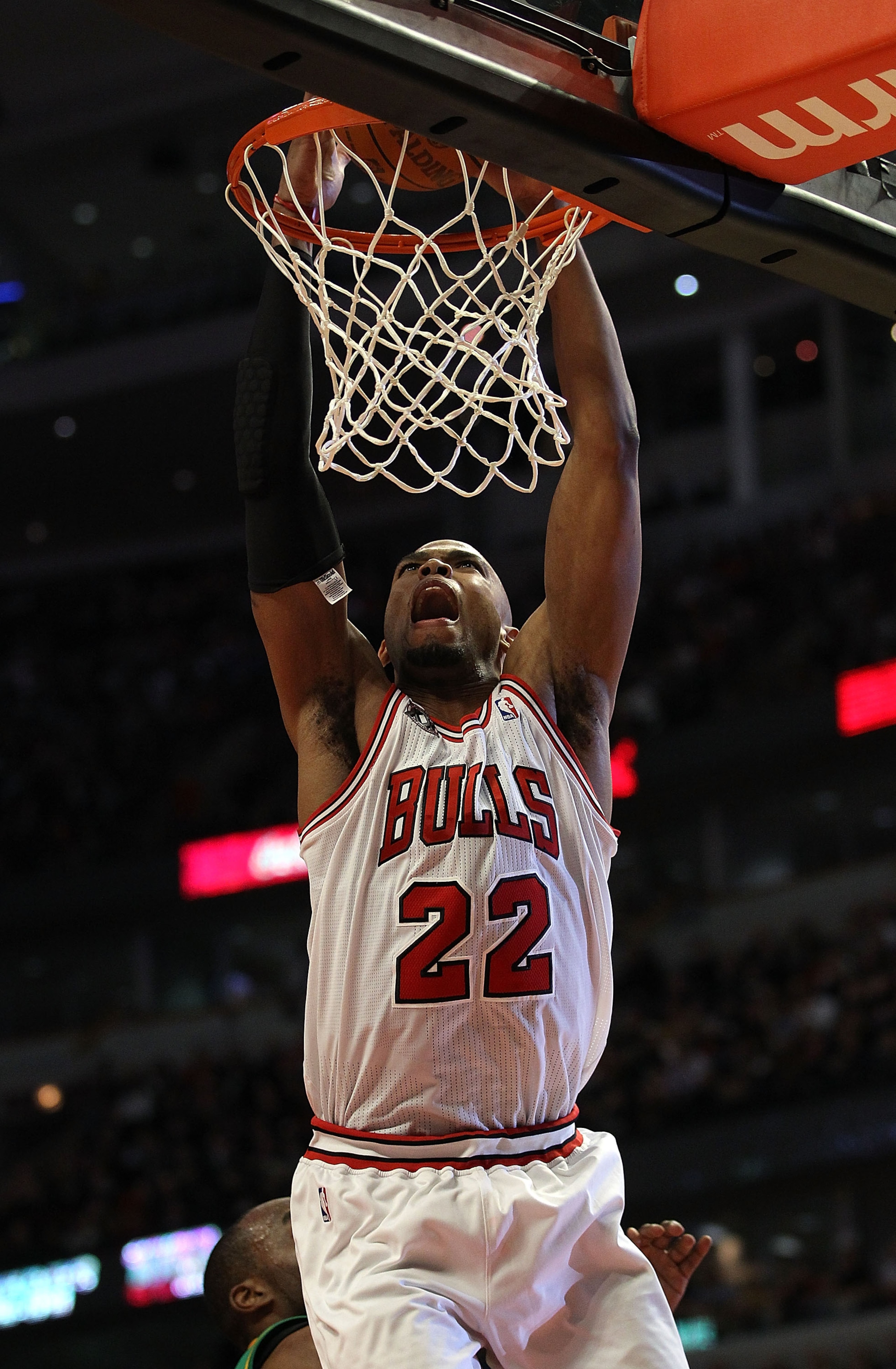 CHICAGO, IL - MARCH 07: Taj Gibson #22 of the Chicago Bulls goes up for a dunk against the New Orleans Hornets at the United Center on March 7, 2011 in Chicago, Illinois. The Bulls defeated the Hornets 85-77. NOTE TO USER: User expressly acknowledges and