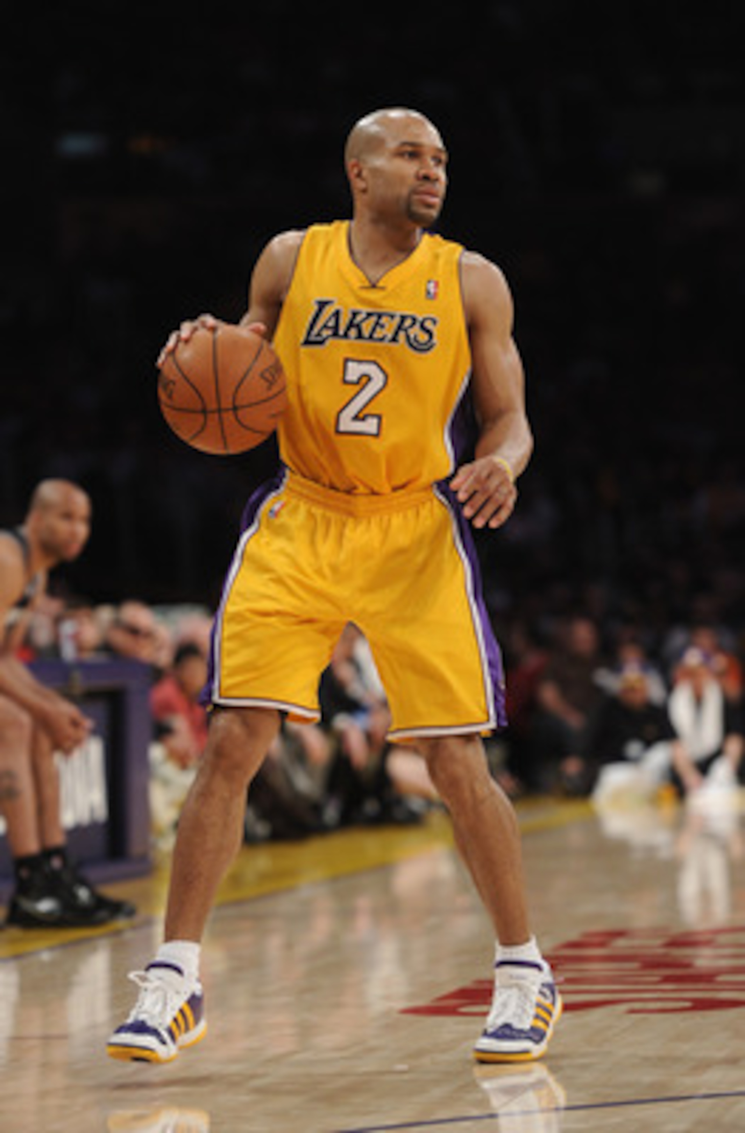 LOS ANGELES, CA - APRIL 12:  Derek Fisher #2 of the Los Angeles Lakers dribbles against the San Antonio Spurs at Staples Center on April 12, 2011 in Los Angeles, California.  NOTE TO USER: User expressly acknowledges and agrees that, by downloading and or