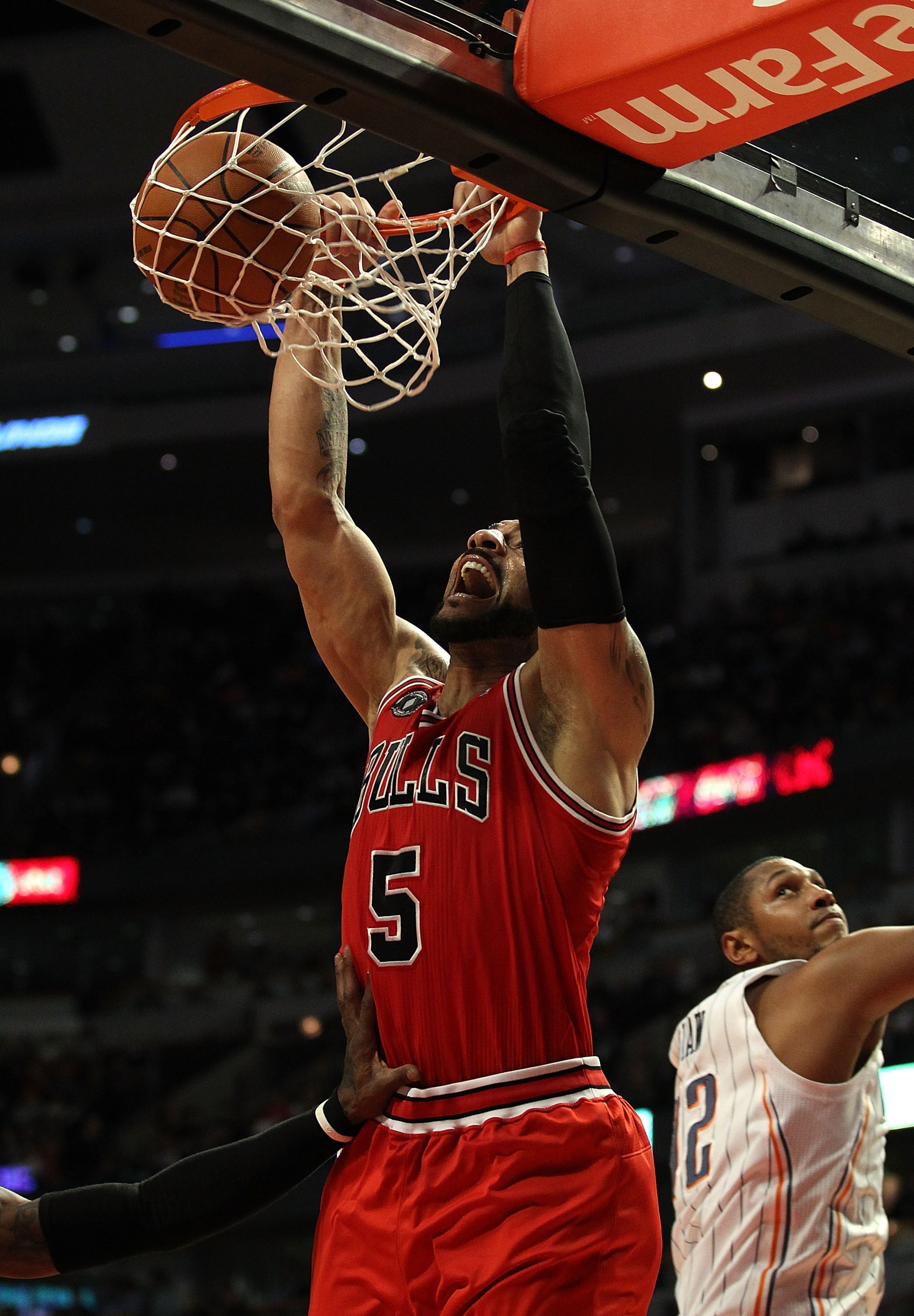 CHICAGO, IL - FEBRUARY 15: Carlos Boozer #5 of the Chicago Bulls dunks the ball against the Charlotte Bobcats at the United Center on February 15, 2011 in Chicago, Illinois. The Bulls defeated the Bobcats 106-94. NOTE TO USER: User expressly acknowledges