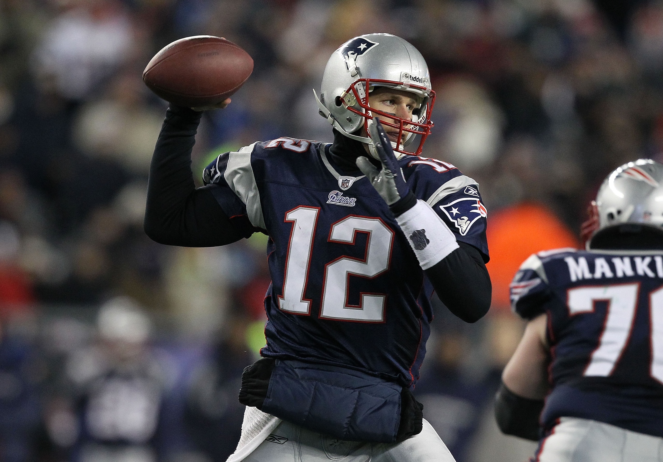 FOXBORO, MA - JANUARY 16: Quarterback Tom Brady #12 of the New England Patriots throws a pass during their 2011 AFC divisional playoff game against the New York Jets at Gillette Stadium on January 16, 2011 in Foxboro, Massachusetts. (Photo by Al Bello/G FOXBORO, MA - JANUARY 16: Quarterback Tom Brady #12 of the New England Patriots throws a pass during their 2011 AFC divisional playoff game against the New York Jets at Gillette Stadium on January 16, 2011 in Foxboro, Massachusetts. (Photo by Al Bello/G