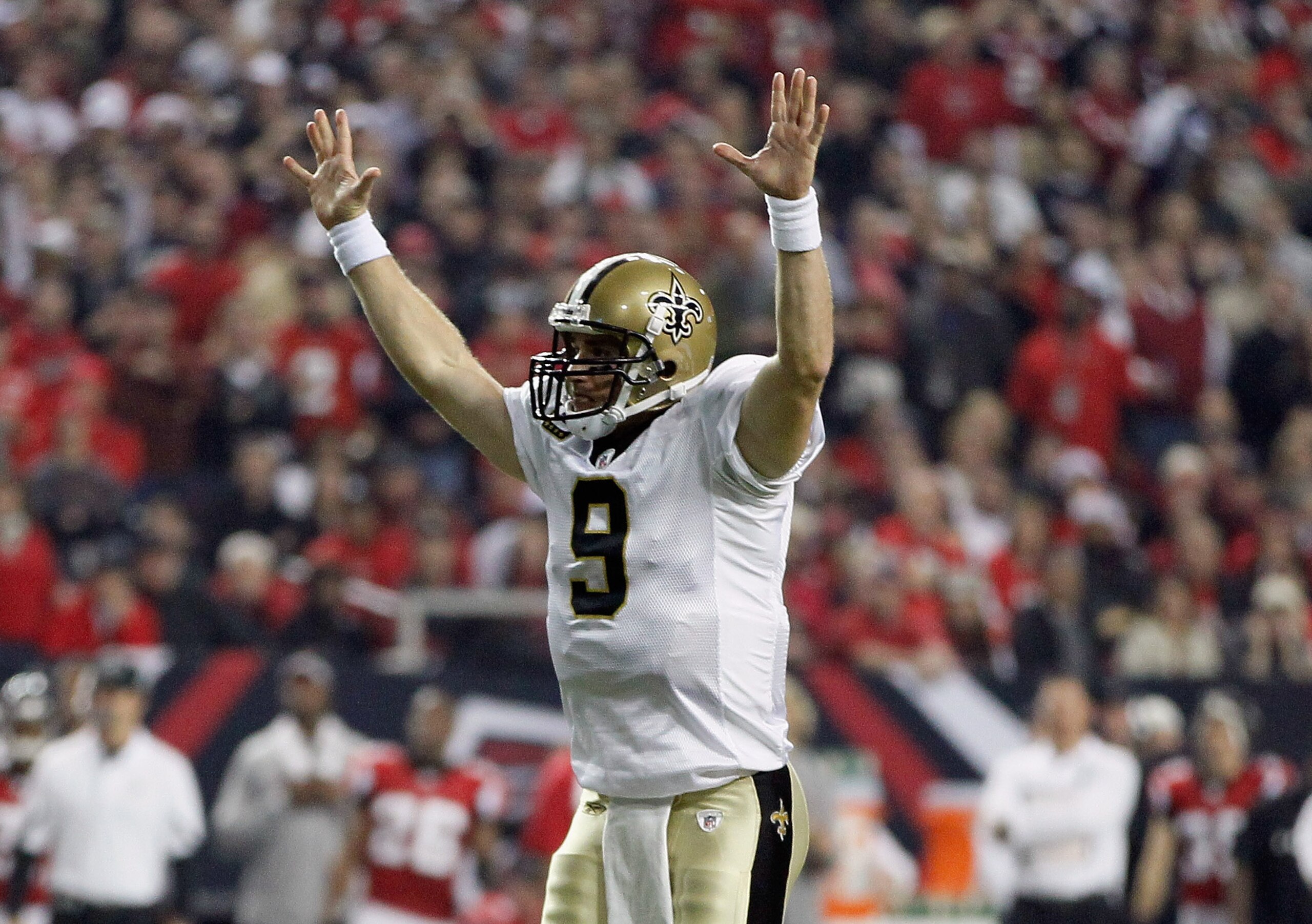 ATLANTA, GA - DECEMBER 27: Quarterback Drew Brees #9 of the New Orleans Saints celebrates a touchdown pass in the first half during the game against the Atlanta Falcons at the Georgia Dome on December 27, 2010 in Atlanta, Georgia. (Photo by Kevin C. Cox ATLANTA, GA - DECEMBER 27: Quarterback Drew Brees #9 of the New Orleans Saints celebrates a touchdown pass in the first half during the game against the Atlanta Falcons at the Georgia Dome on December 27, 2010 in Atlanta, Georgia. (Photo by Kevin C. Cox