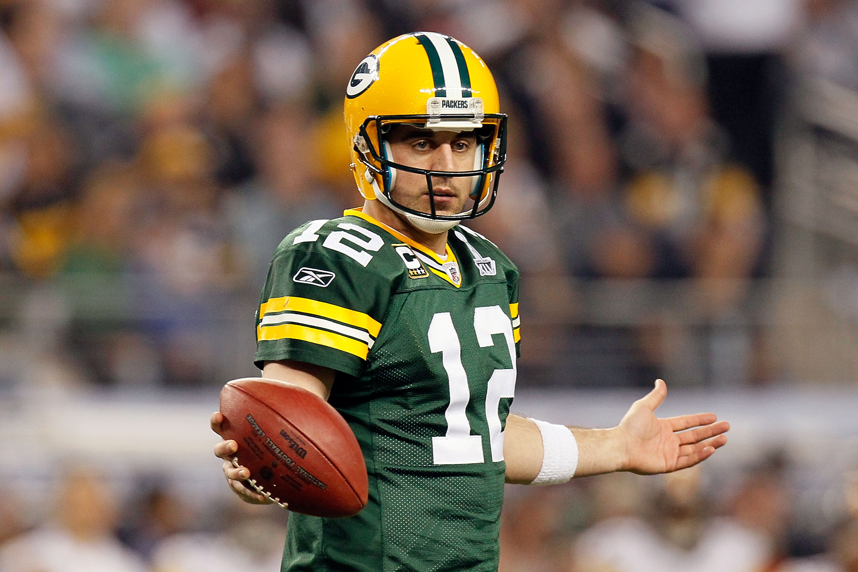 ARLINGTON, TX - FEBRUARY 06: Aaron Rodgers #12 of the Green Bay Packers looks to the sideline during the second half of Super Bowl XLV against the Pittsburgh Steelers at Cowboys Stadium on February 6, 2011 in Arlington, Texas.  (Photo by Kevin C. Cox/Gett