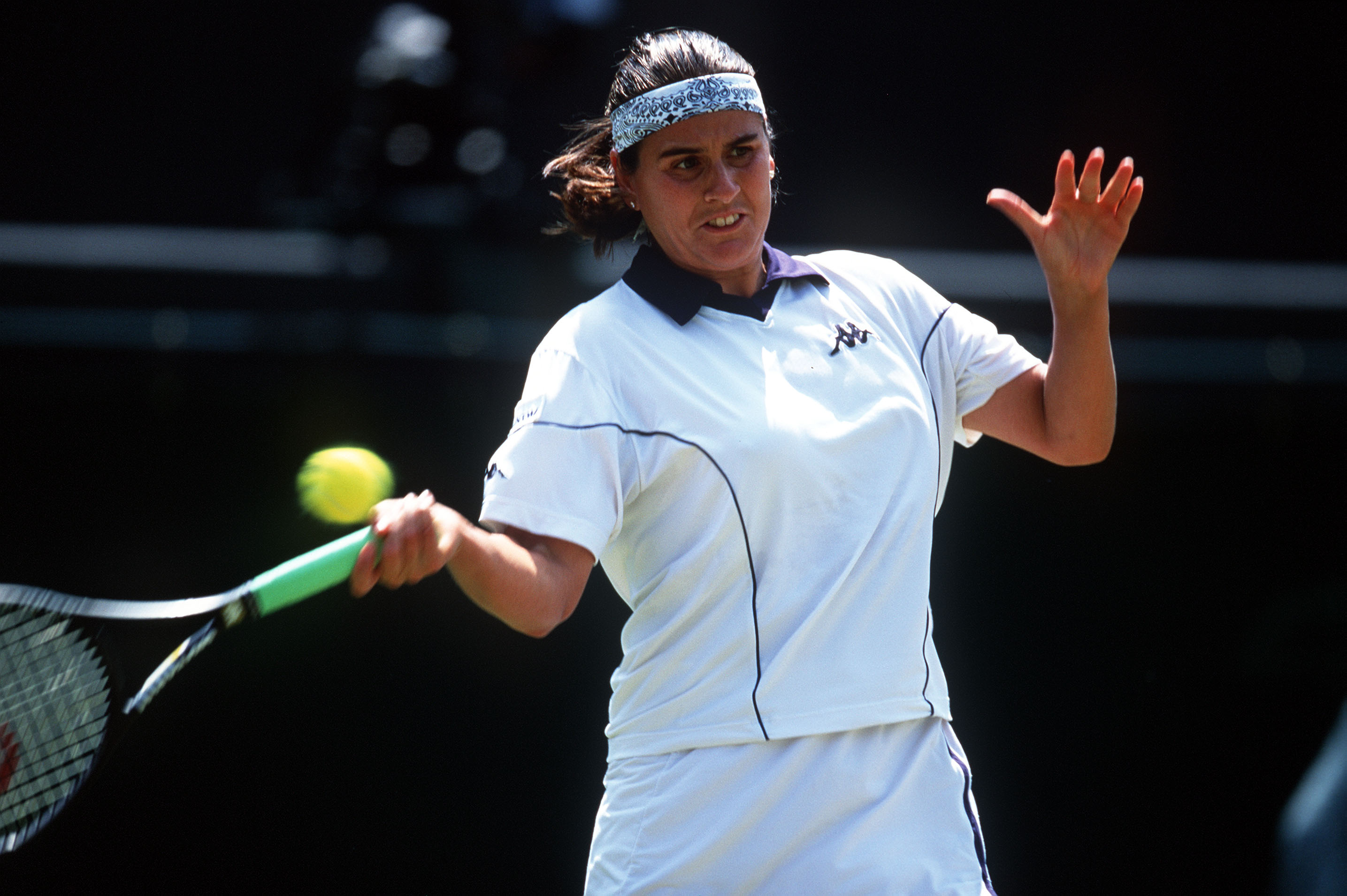 3 Jul 2001:  Conchita Martinez of Spain in action against Justine Henin of Belgium during the women's quarter finals of The All England Lawn Tennis Championship at Wimbledon, London.   Mandatory Credit: Alex Livesey/ALLSPORT