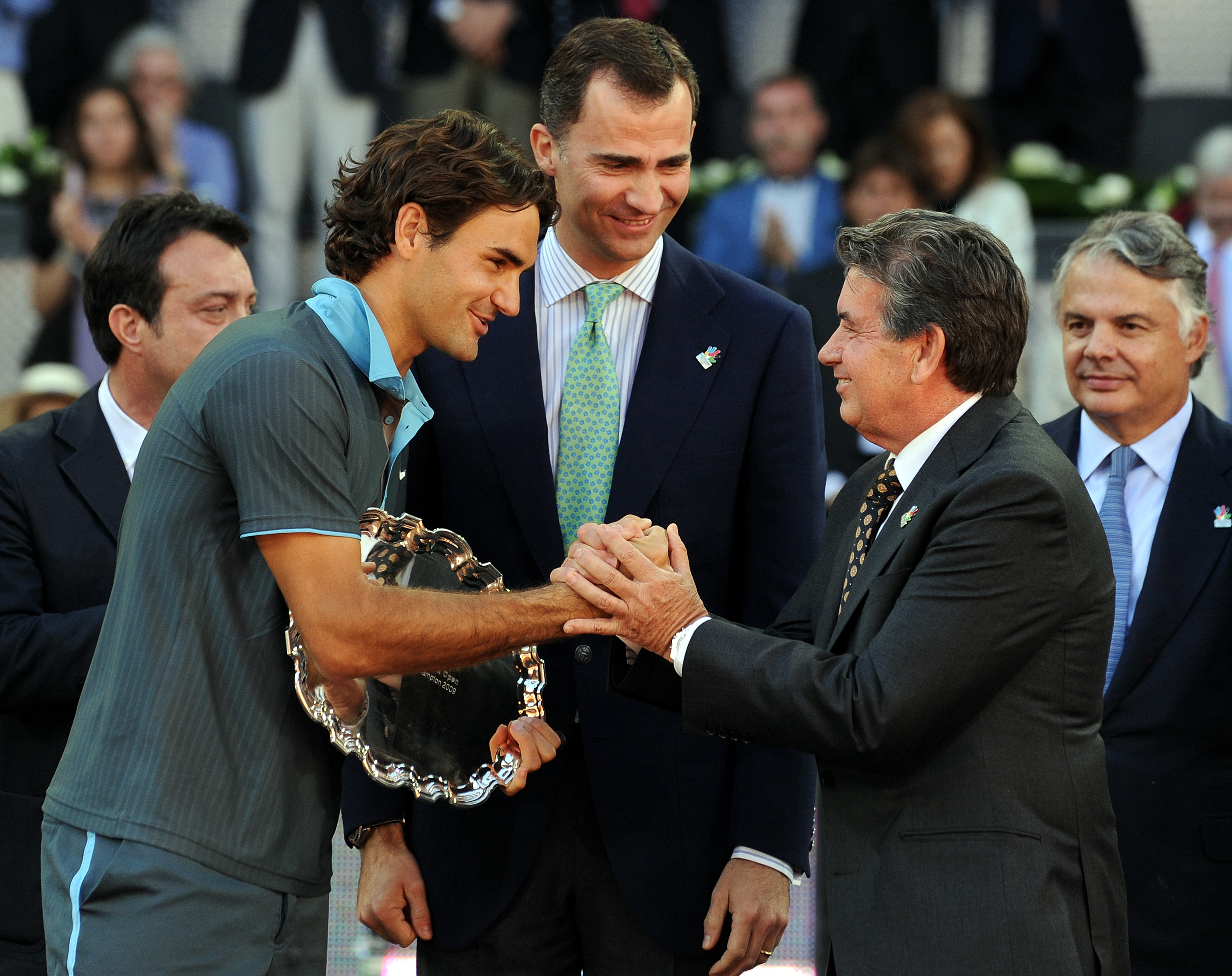 MADRID, SPAIN - MAY 17:  Roger Federer (L) of Switzerland is greeted by  former tennis great Manolo Santana (R) flanked by Crown Prince Felipe (C) of Spain after his straight set victory against Rafael Nadal of Spain during the final of the Madrid Open te