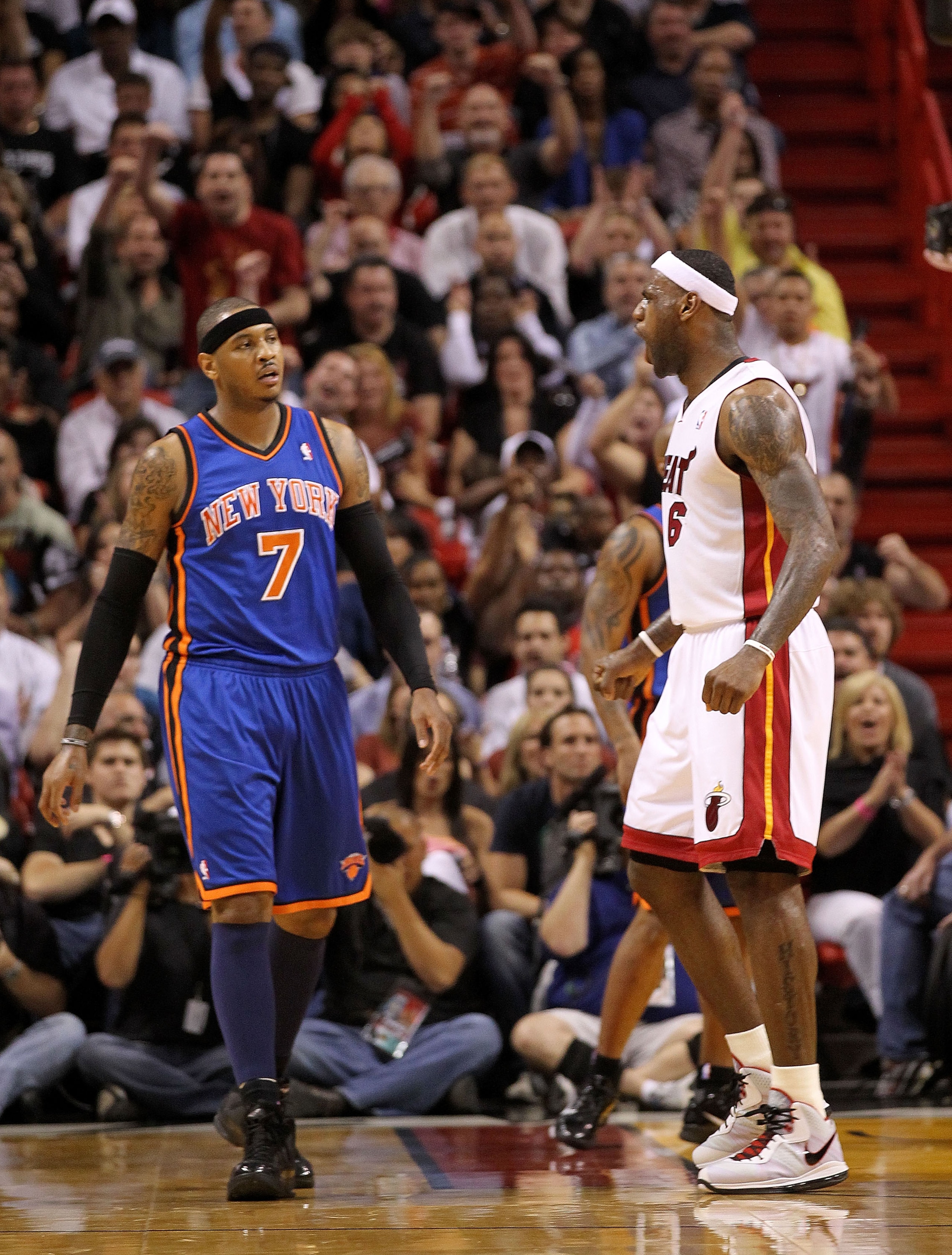 MIAMI, FL - FEBRUARY 27: LeBron James #6 of the Miami Heat reacts to a shot as Carmelo Anthony #7 of the New York Knicks looks on during a game at American Airlines Arena on February 27, 2011 in Miami, Florida. NOTE TO USER: User expressly acknowledges an