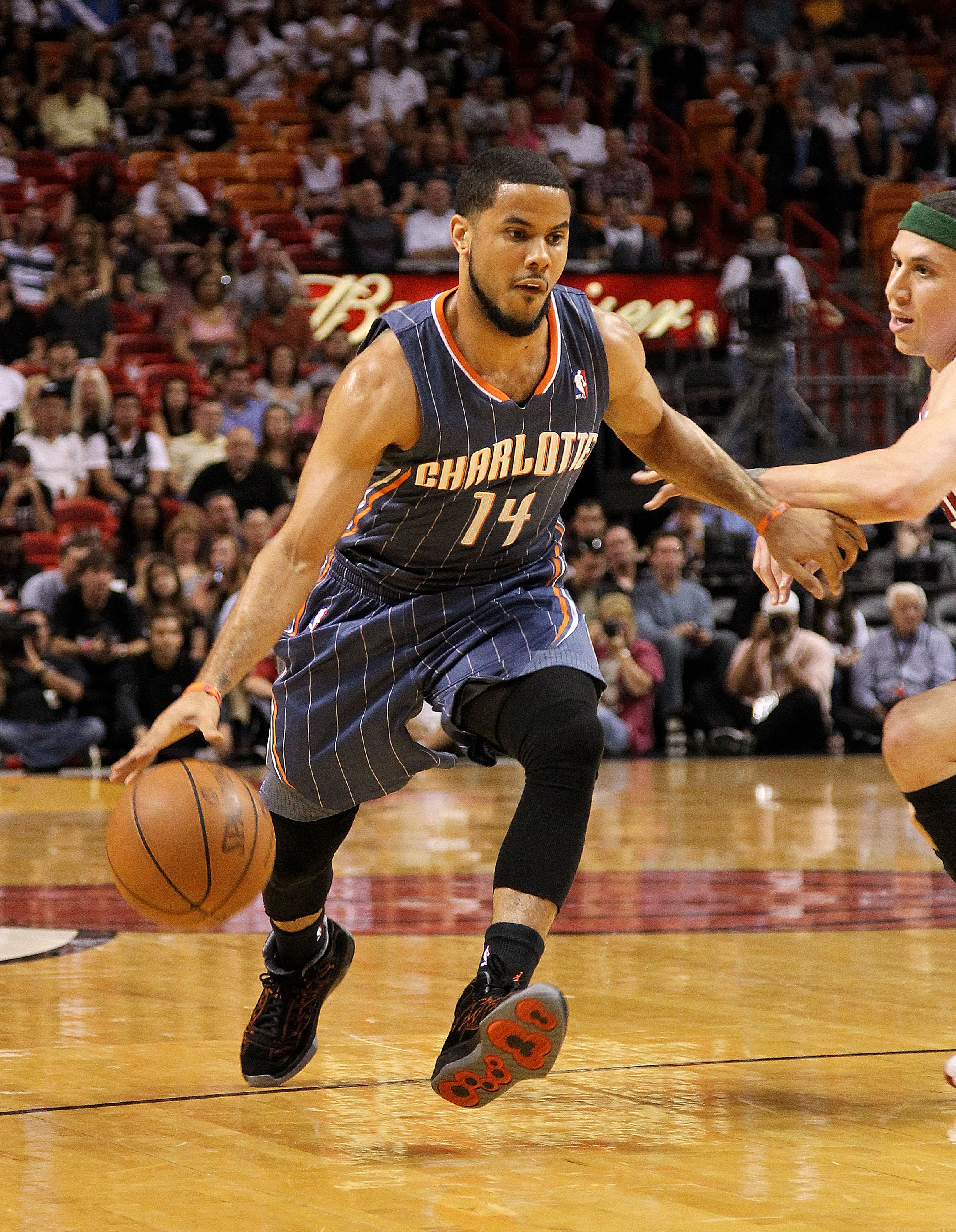 MIAMI, FL - APRIL 08:  D.J. Augustin #14 of the Charlotte Bobcats drives to the lane during a game against the Miami Heat at American Airlines Arena on April 8, 2011 in Miami, Florida. NOTE TO USER: User expressly acknowledges and agrees that, by download