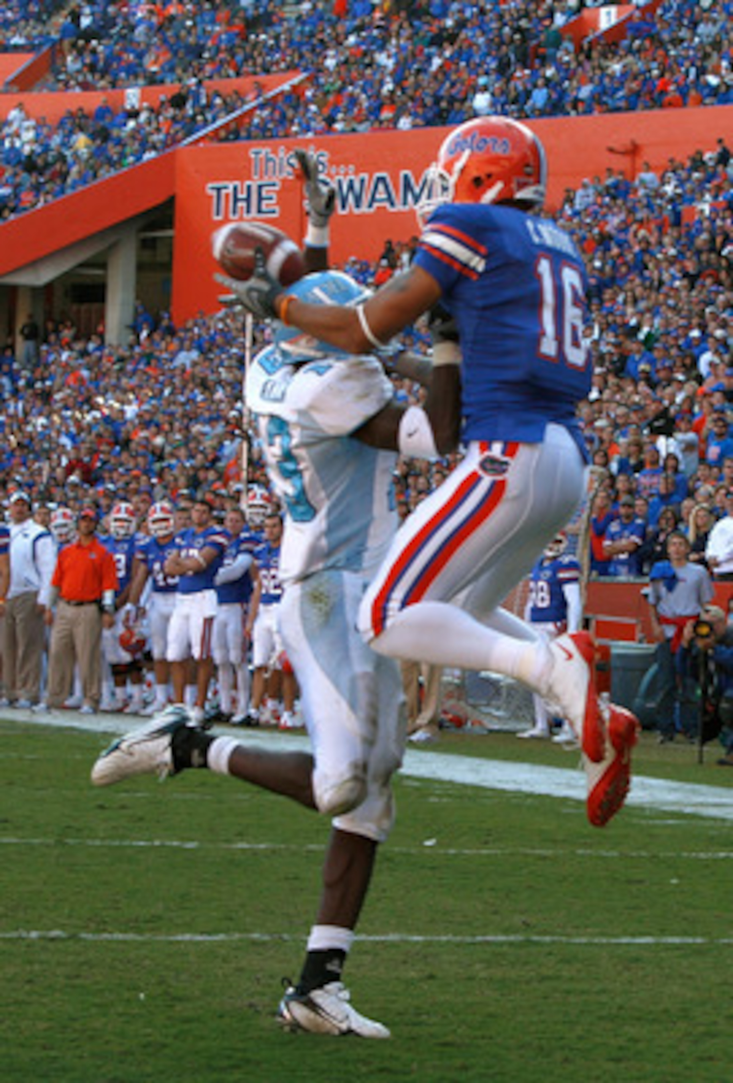 GAINESVILLE, FL - NOVEMBER 22:  Carl Moore #16 of the Florida Gators catches a pass against Cortez Allen #13 of the Citadel Bulldogs during the game at Ben Hill Griffin Stadium on November 22, 2008 in Gainesville, Florida.  (Photo by Sam Greenwood/Getty I