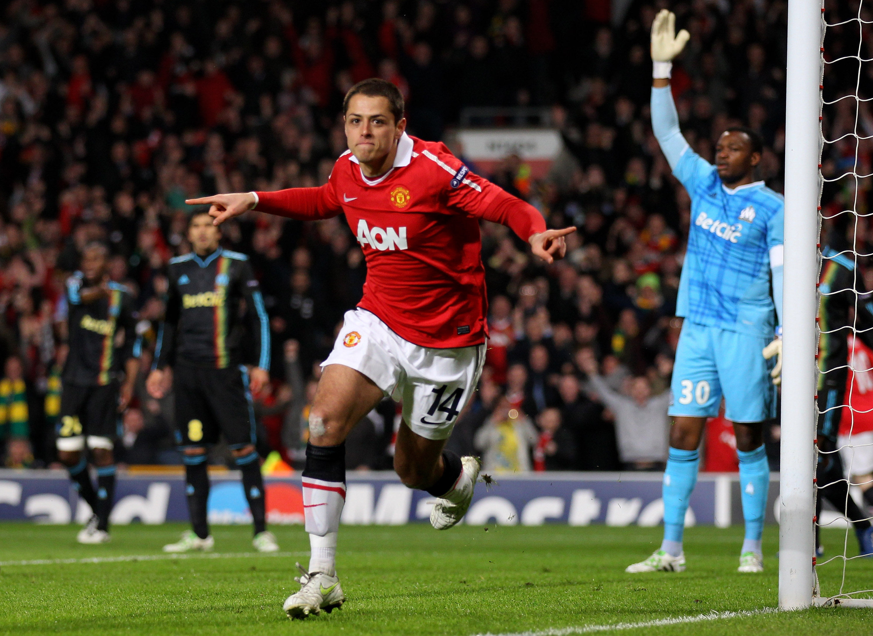 MANCHESTER, ENGLAND - MARCH 15:  Javier Hernandez of Manchester United celebrates scoring the opening goal during the UEFA Champions League round of 16 second leg match between Manchester United and Marseille at Old Trafford on March 15, 2011 in Mancheste