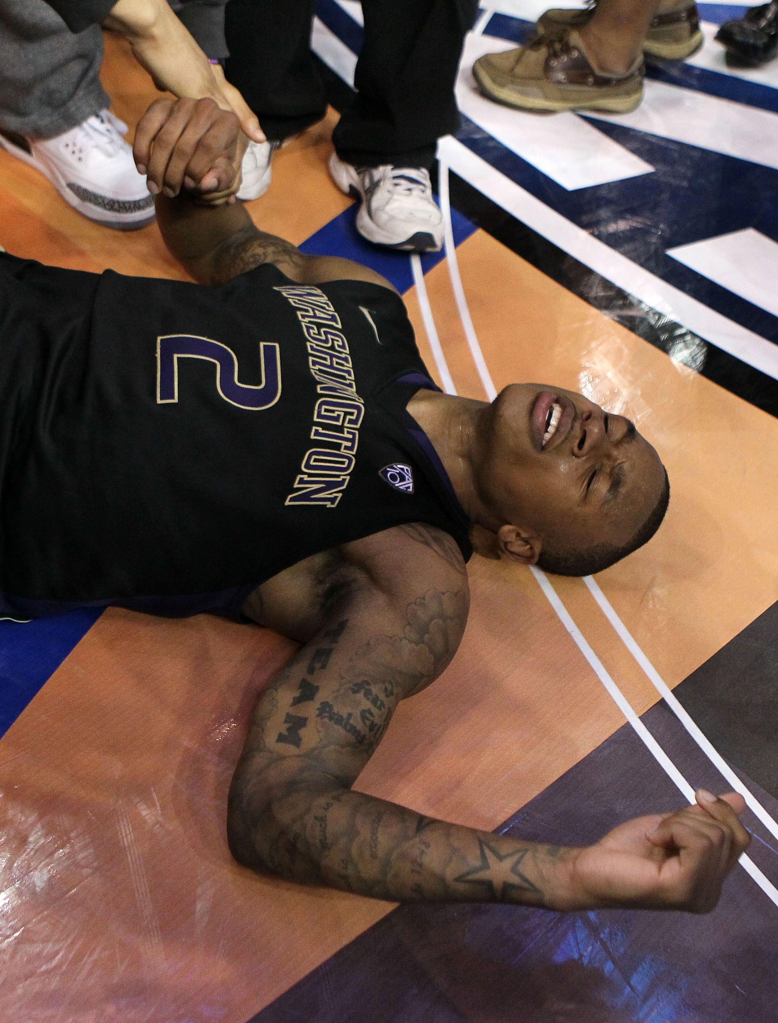 LOS ANGELES, CA - MARCH 12: Isaiah Thomas #2 of the Washington Huskies reacts after making a last-second shot in overtime to defeat the Arizona Wildcats 77-75 in the championship game of the 2011 Pacific Life Pac-10 Men's Basketball Tournament at Staples