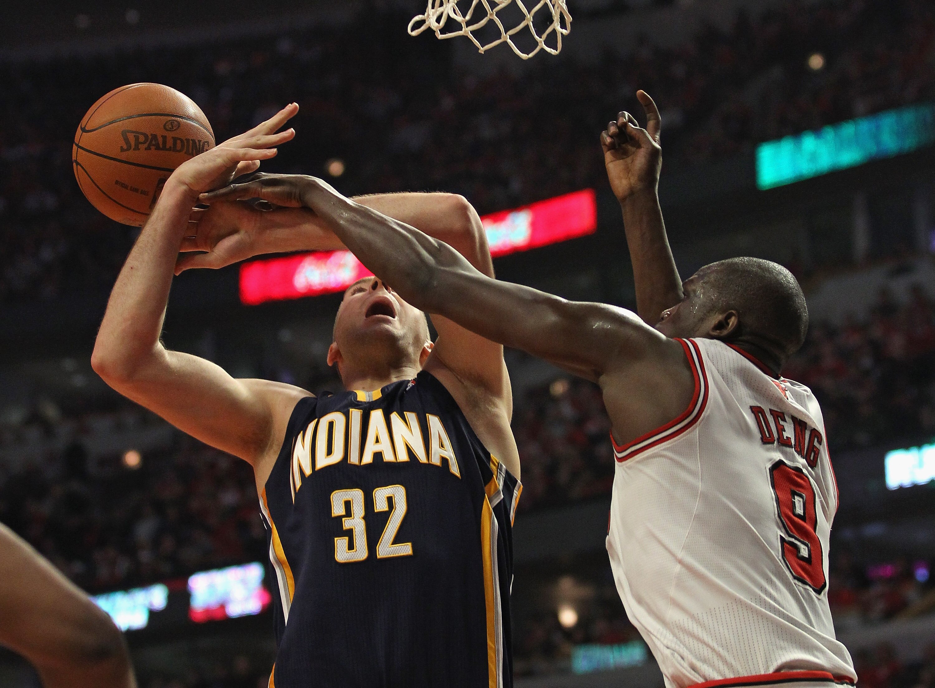 CHICAGO, IL - APRIL 16: Josh McRoberts #32 of the Indiana Pacers is fouled by Loul Deng #9 of the Chicago Bulls in Game One of the Eastern Conference Quarterfinals in the 2011 NBA Playoffs at the United Center on April 16, 2011 in Chicago, Illinois. NOTE