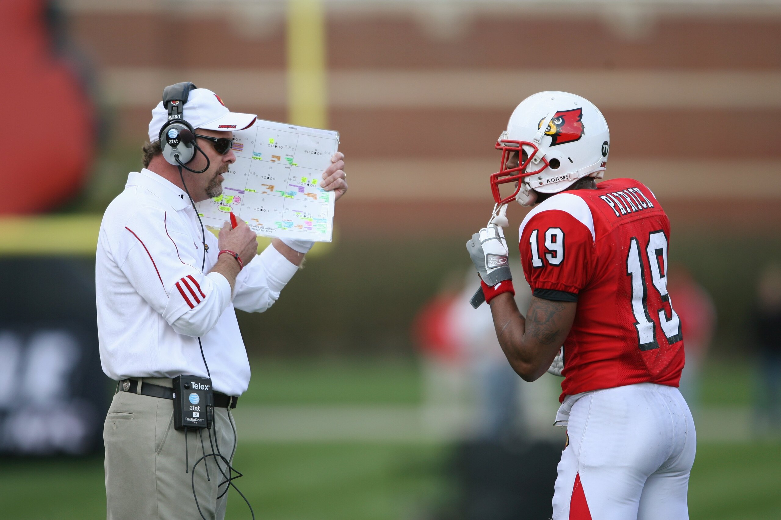 LOUISVILLE, KY - OCTOBER 18: Head Coach Steve Kragthorpe of the Louisville Cardinals discusses play with Johnny Patrick #19 during the game against the Middle Tennessee Blue Raiders at Papa John's Cardinal Stadium on October 18, 2008 in Louisville, Kentu LOUISVILLE, KY - OCTOBER 18: Head Coach Steve Kragthorpe of the Louisville Cardinals discusses play with Johnny Patrick #19 during the game against the Middle Tennessee Blue Raiders at Papa John's Cardinal Stadium on October 18, 2008 in Louisville, Kentu