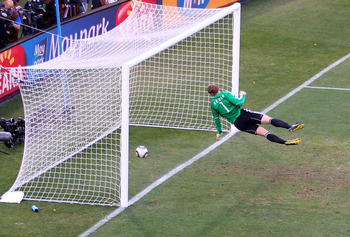 BLOEMFONTEIN, SOUTH AFRICA - JUNE 27:  Manuel Neuer of Germany watches the ball bounce over the line from a shot that hit the crossbar from Frank Lampard of England, but referee Jorge Larrionda judges the ball did not cross the line during the 2010 FIFA W