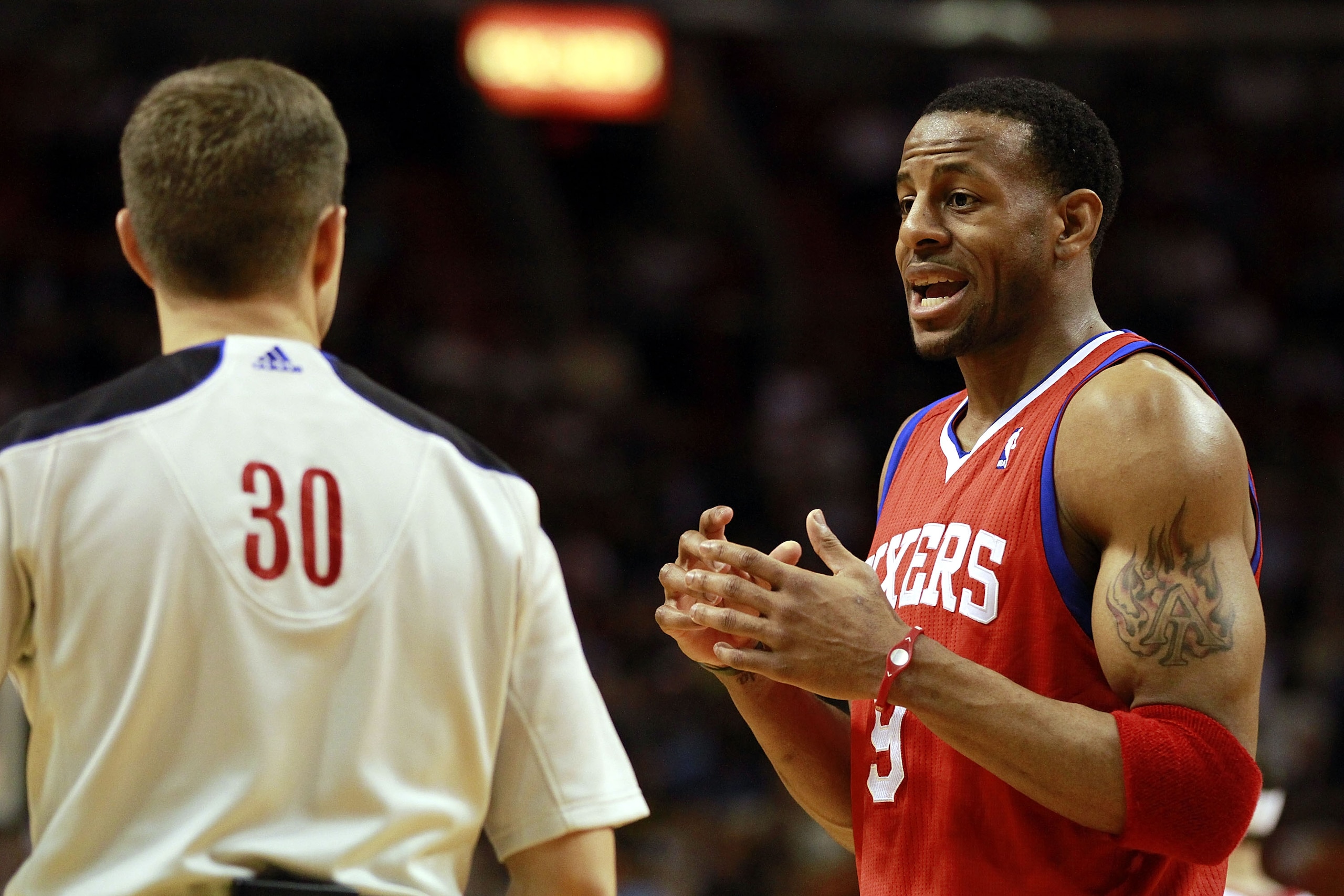 MIAMI, FL - MARCH 25: Guard Andr Iguodala #9 of the Philadelphia Sixers argues with the referee against the Miami Heat at American Airlines Arena on March 25, 2011 in Miami, Florida. The Heat defeated the Sixers 111-99. NOTE TO USER: User expressly ackno MIAMI, FL - MARCH 25: Guard Andr Iguodala #9 of the Philadelphia Sixers argues with the referee against the Miami Heat at American Airlines Arena on March 25, 2011 in Miami, Florida. The Heat defeated the Sixers 111-99. NOTE TO USER: User expressly ackno