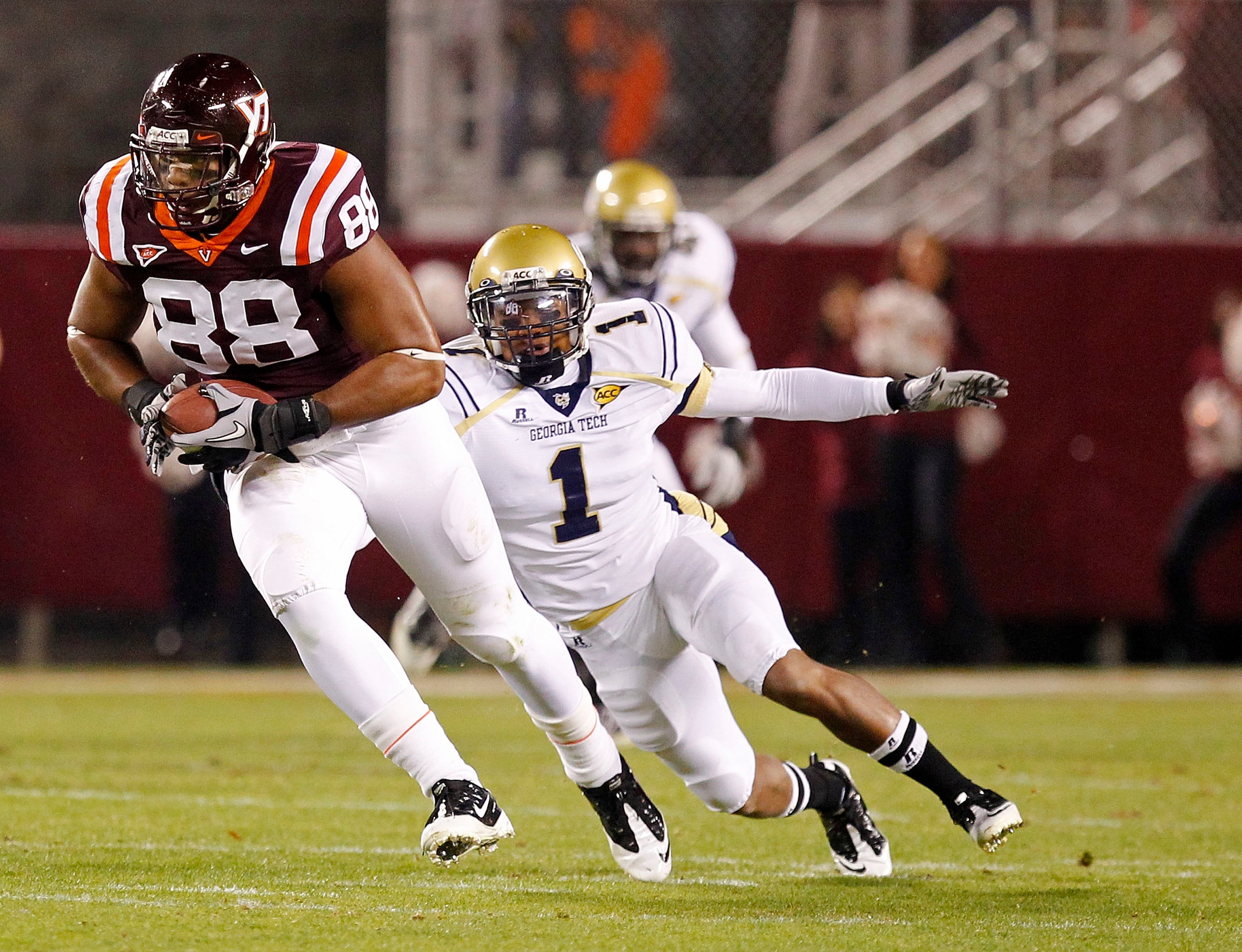 BLACKSBURG, VA - NOVEMBER 04: Tight end Andre Smith #88 of the Virginia Tech Hokies runs with the ball past safety Isaiah Johnson #1 of the Georgia Tech Yellow Jackets at Lane Stadium on November 4, 2010 in Blacksburg, Virginia. (Photo by Geoff Burke/Get BLACKSBURG, VA - NOVEMBER 04: Tight end Andre Smith #88 of the Virginia Tech Hokies runs with the ball past safety Isaiah Johnson #1 of the Georgia Tech Yellow Jackets at Lane Stadium on November 4, 2010 in Blacksburg, Virginia. (Photo by Geoff Burke/Get