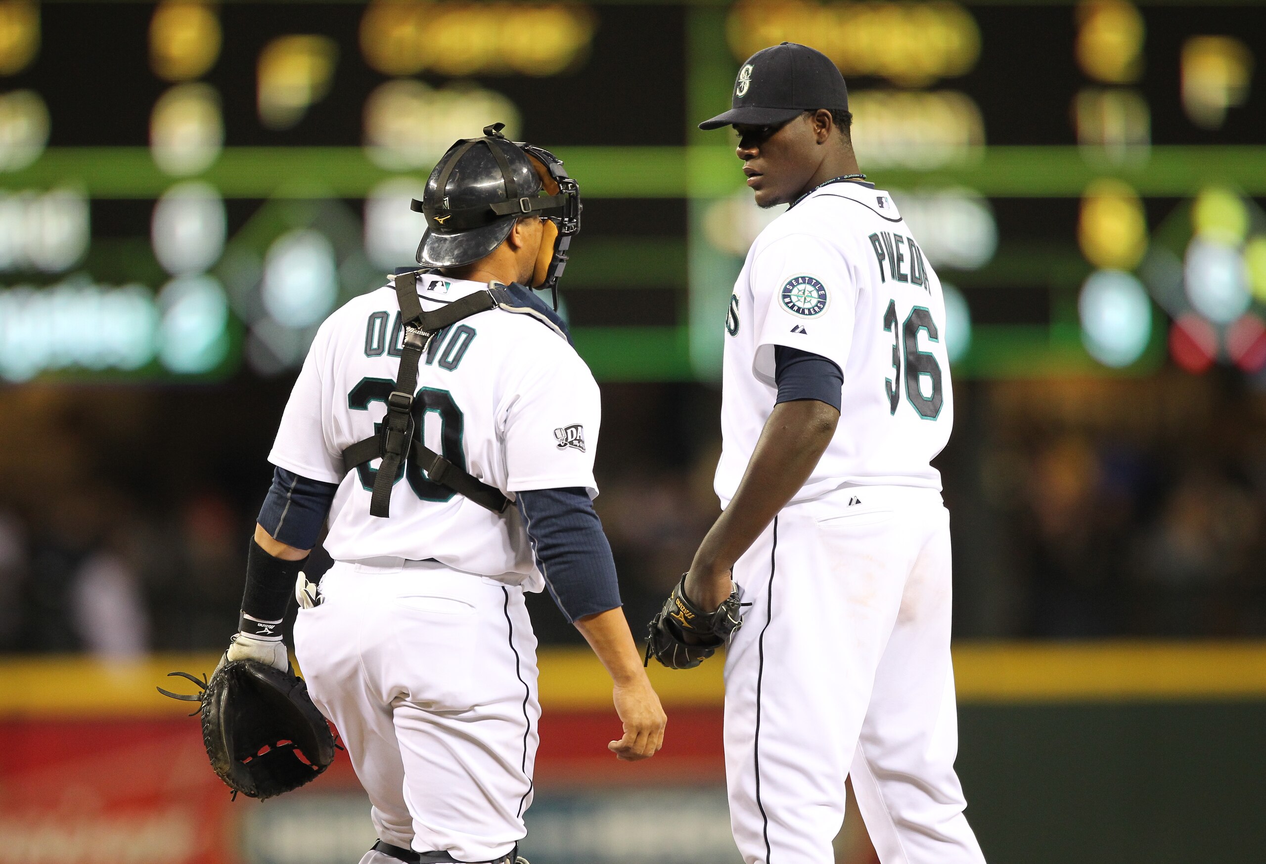 SEATTLE, WA - APRIL 12:  Starting pitcher Michael Pineda #36 of the Seattle Mariners talks with catcher Miguel Olivo #30 during the game against the Toronto Blue Jays at Safeco Field on April 12, 2011 in Seattle, Washington. (Photo by Otto Greule Jr/Getty