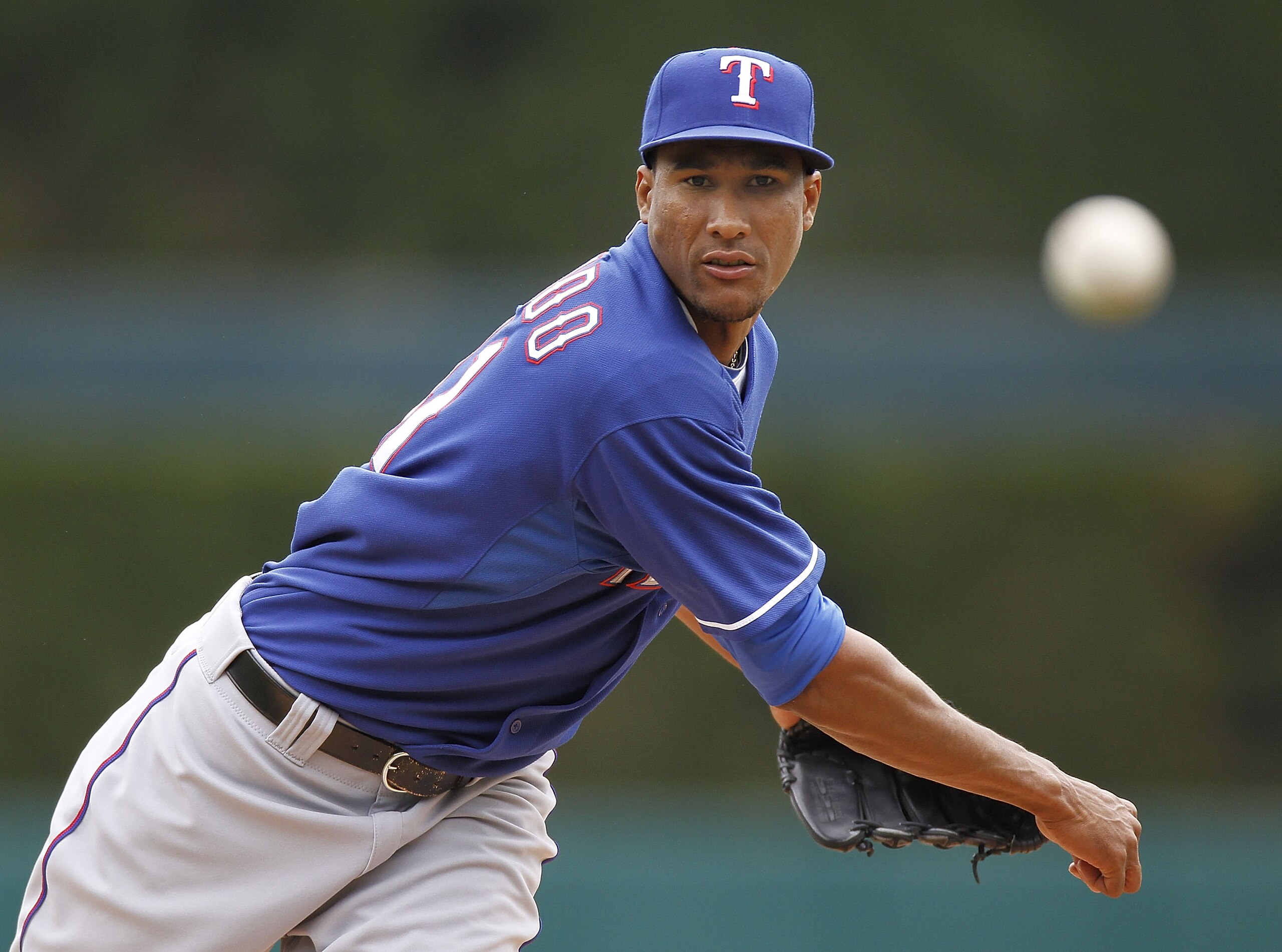 DETROIT, MI - APRIL 11:  Alexi Ogando #41 of the Texas Rangers throws a pitch while playing the Detroit Tigers at Comerica Park on April 11, 2011 in Detroit, Michigan.  (Photo by Gregory Shamus/Getty Images)