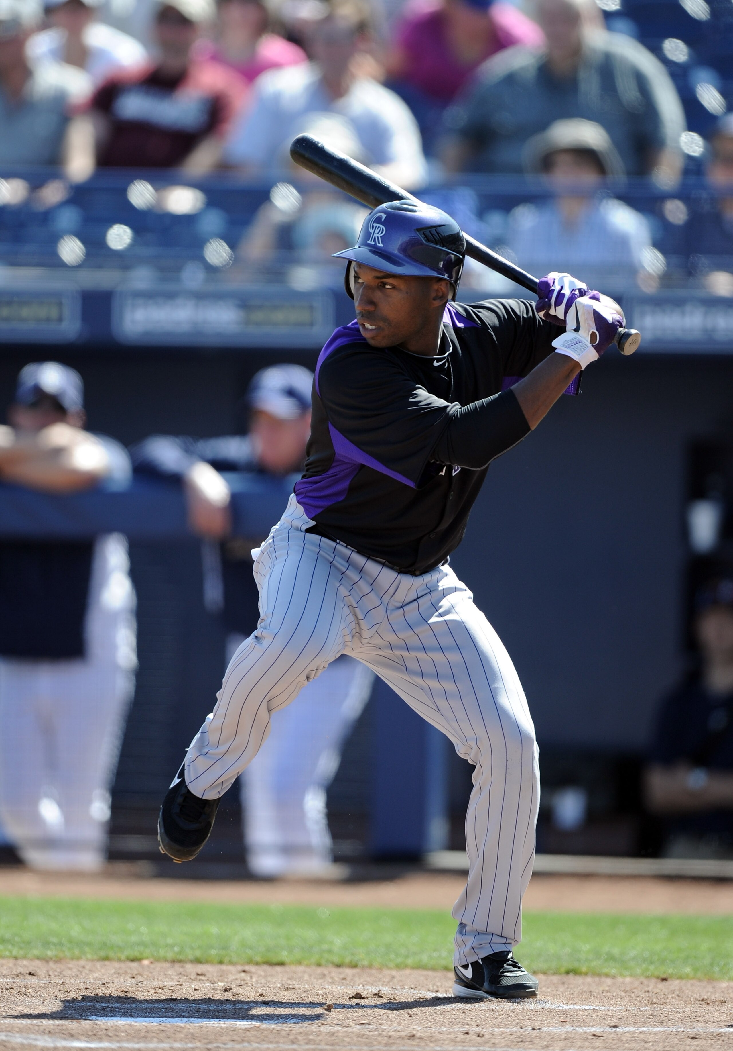PEORIA, AZ - MARCH 02:  Jonathan Herrera #18 of the Colorado Rockies at bat against the San Diego Padres during spring training at Peoria Stadium on March 2, 2011 in Peoria, Arizona.  (Photo by Harry How/Getty Images)