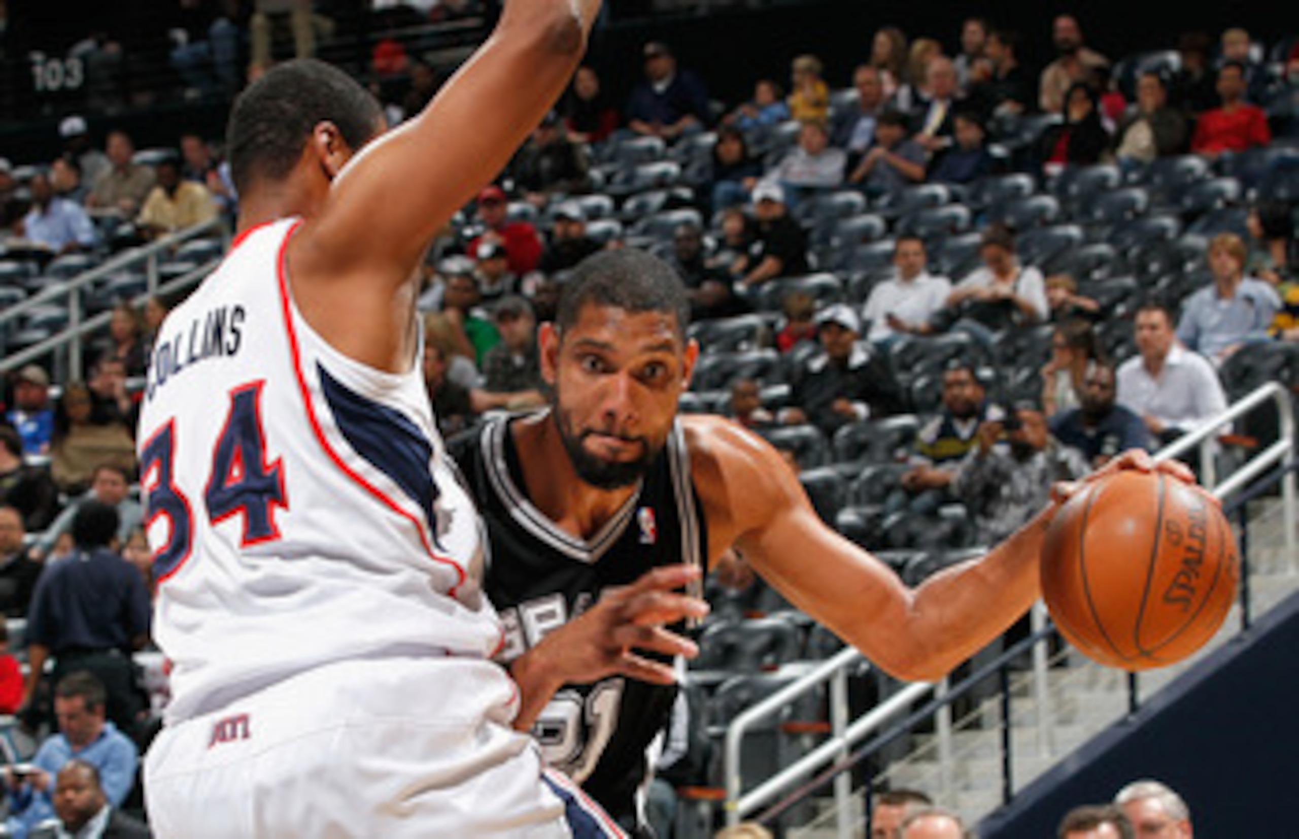 ATLANTA, GA - APRIL 05: Tim Duncan #21 of the San Antonio Spurs against Jason Collins #34 of the Atlanta Hawks at Philips Arena on April 5, 2011 in Atlanta, Georgia. NOTE TO USER: User expressly acknowledges and agrees that, by downloading and/or using ATLANTA, GA - APRIL 05: Tim Duncan #21 of the San Antonio Spurs against Jason Collins #34 of the Atlanta Hawks at Philips Arena on April 5, 2011 in Atlanta, Georgia. NOTE TO USER: User expressly acknowledges and agrees that, by downloading and/or using