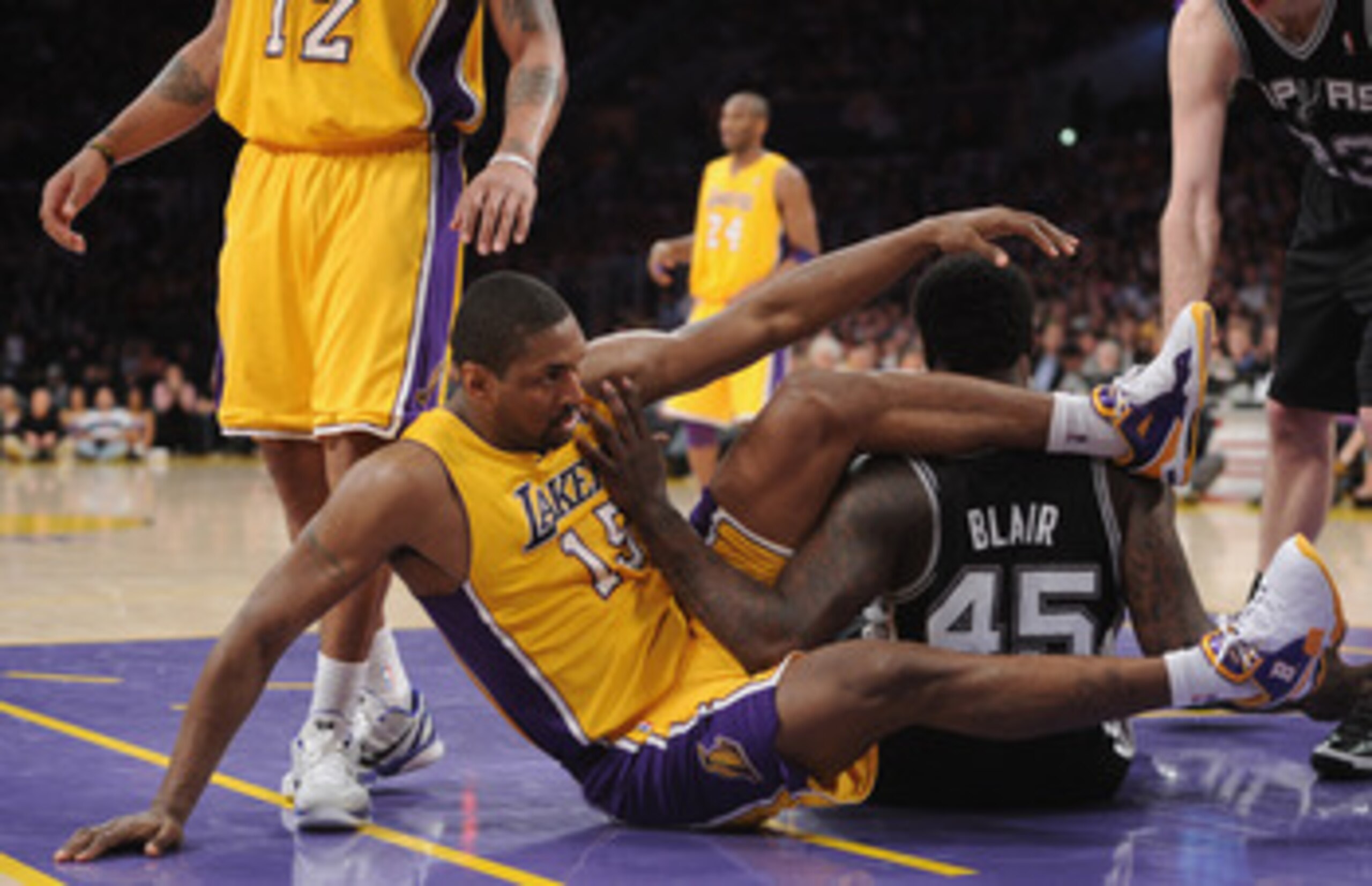 LOS ANGELES, CA - APRIL 12: Ron Artest #15 of the Los Angeles Lakers and DeJuan Blair #45 of the San Antonio Spurs get tangled at Staples Center on April 12, 2011 in Los Angeles, California. NOTE TO USER: User expressly acknowledges and agrees that, by LOS ANGELES, CA - APRIL 12: Ron Artest #15 of the Los Angeles Lakers and DeJuan Blair #45 of the San Antonio Spurs get tangled at Staples Center on April 12, 2011 in Los Angeles, California. NOTE TO USER: User expressly acknowledges and agrees that, by