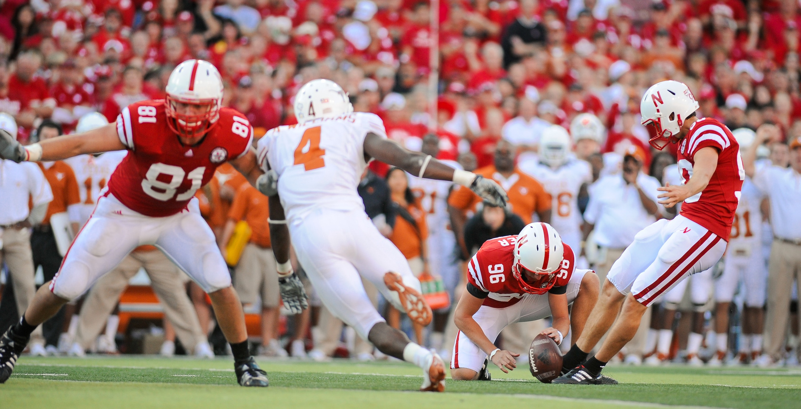 LINCOLN, NE - OCTOBER 16: Kicker Alex Henery #90 of the Nebraska Cornhuskers kicks a ball held by teammate Brett Maher #96 during their game at Memorial Stadium on October 16, 2010 in Lincoln, Nebraska. Texas Defeated Nebraska 20-13. (Photo by Eric Franc LINCOLN, NE - OCTOBER 16: Kicker Alex Henery #90 of the Nebraska Cornhuskers kicks a ball held by teammate Brett Maher #96 during their game at Memorial Stadium on October 16, 2010 in Lincoln, Nebraska. Texas Defeated Nebraska 20-13. (Photo by Eric Franc