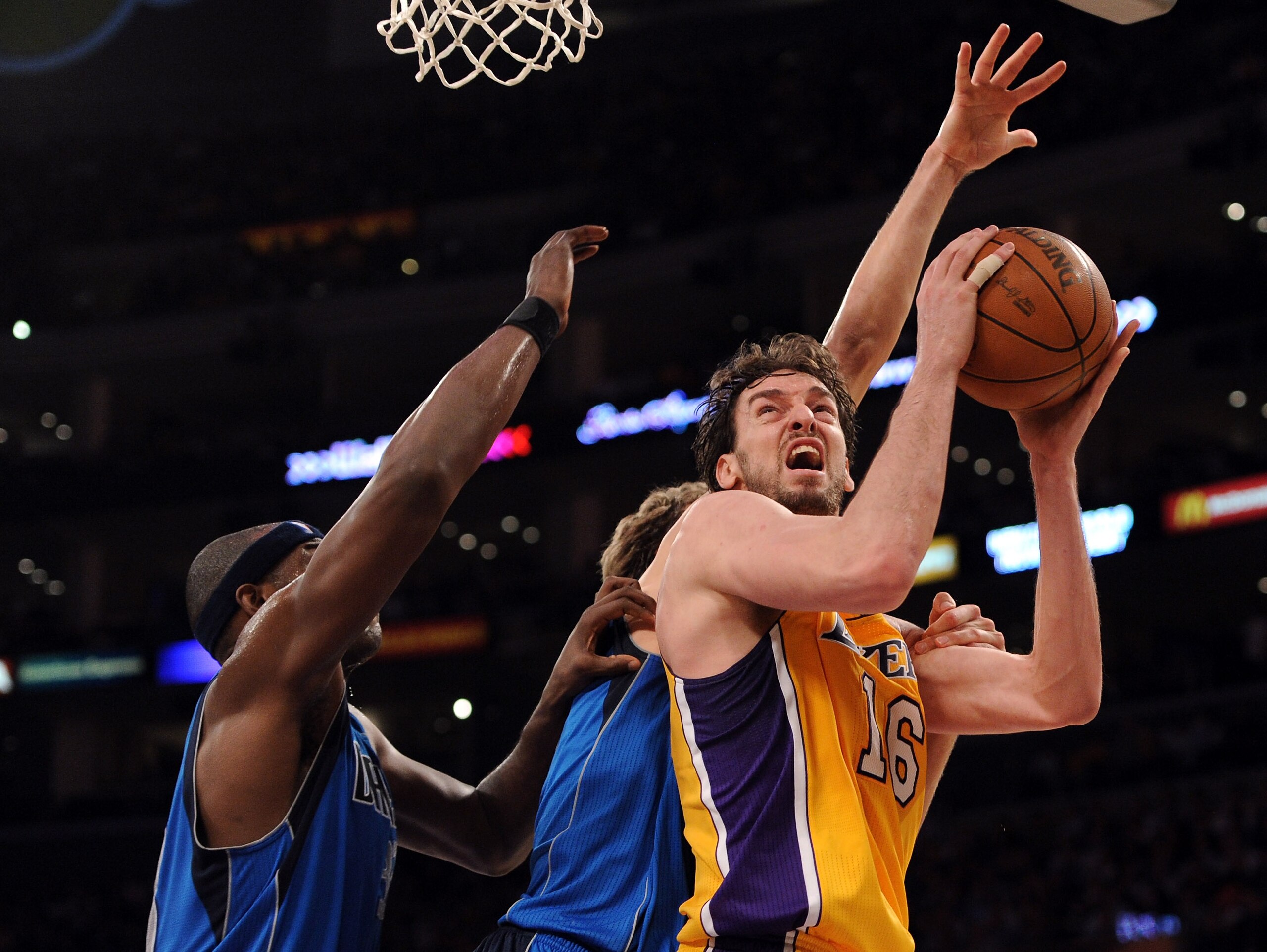 LOS ANGELES, CA - MARCH 31: Paul Gasol #16 of the Los Angeles Lakers shoots in front of Jason Terry #31 and Dirk Nowitzki #41 of the Dallas Mavericks at Staples Center on March 31, 2011 in Los Angeles, California. NOTE TO USER: User expressly acknowledg LOS ANGELES, CA - MARCH 31: Paul Gasol #16 of the Los Angeles Lakers shoots in front of Jason Terry #31 and Dirk Nowitzki #41 of the Dallas Mavericks at Staples Center on March 31, 2011 in Los Angeles, California. NOTE TO USER: User expressly acknowledg