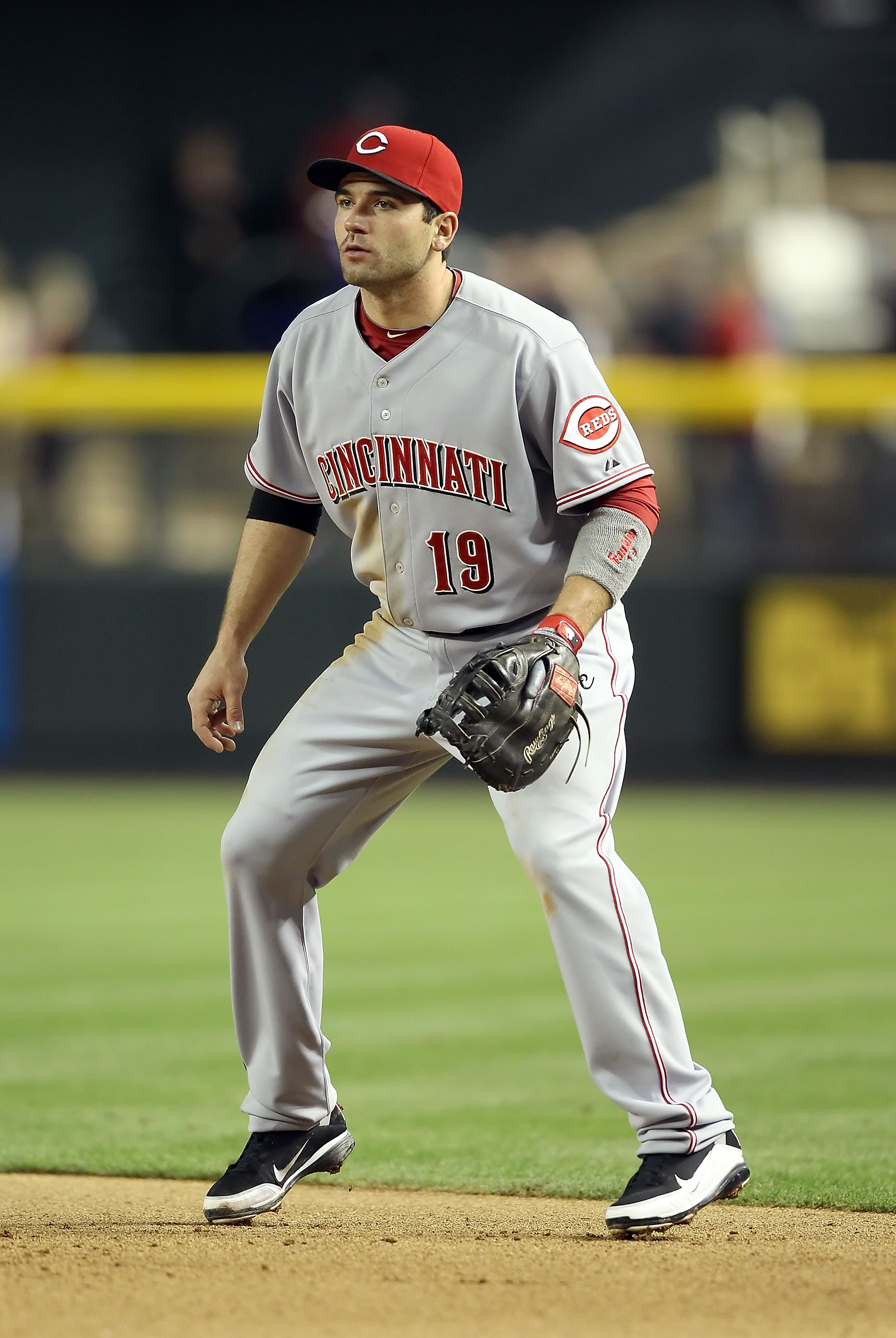 PHOENIX, AZ - APRIL 08:  Inifelder Joey Votto #19 of the Cincinnati Reds in action during the Major League Baseball home opening game against the Arizona Diamondbacks at Chase Field on April 8, 2011 in Phoenix, Arizona. The Diamondbacks defeated the Reds