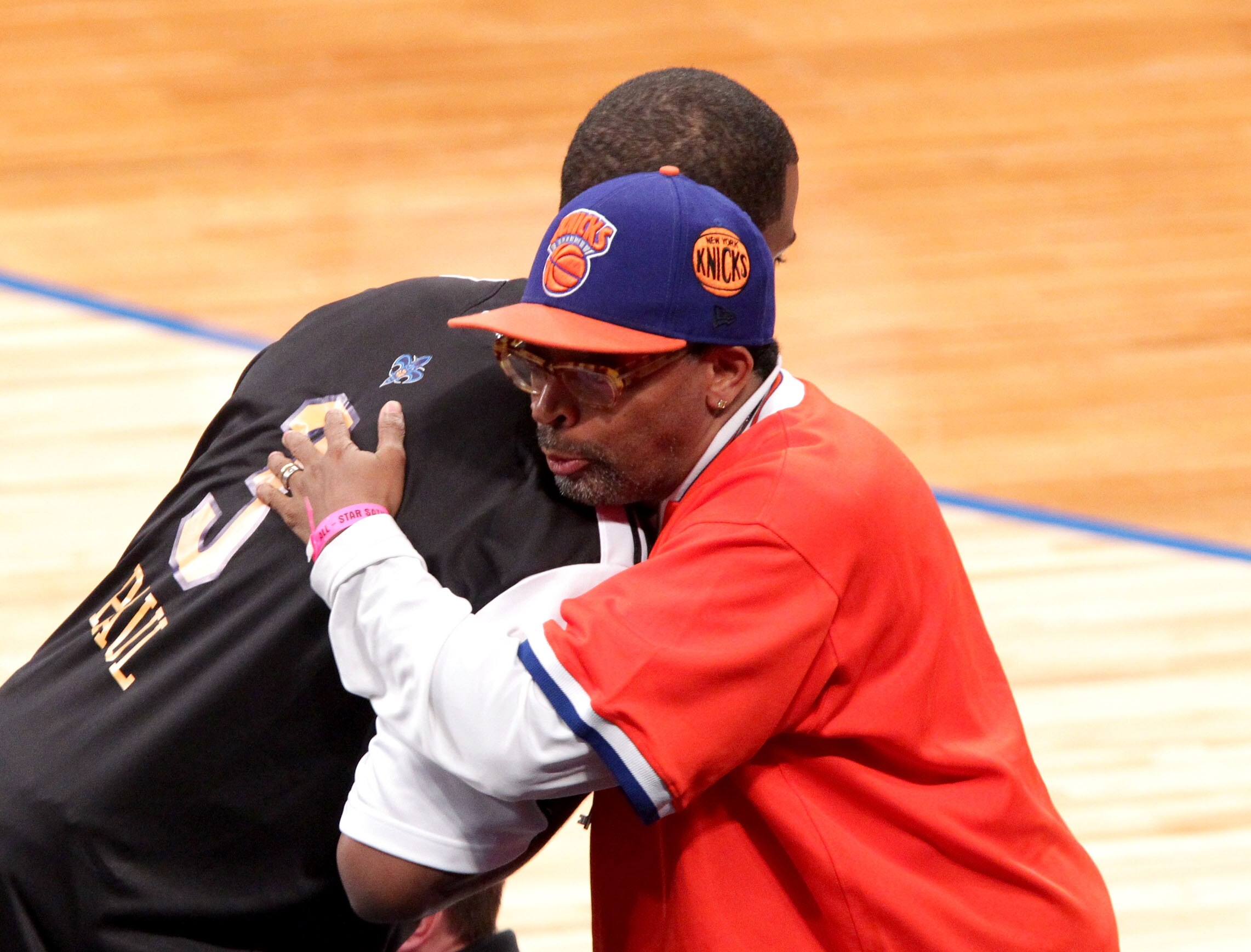 LOS ANGELES, CA - FEBRUARY 19:  NBA player for the New Orleans Hornets (L) and director Spike Lee hug during NBA All-Star Saturday night presented by State Farm at Staples Center on February 19, 2011 in Los Angeles, California.  (Photo by Noel Vasquez/Get