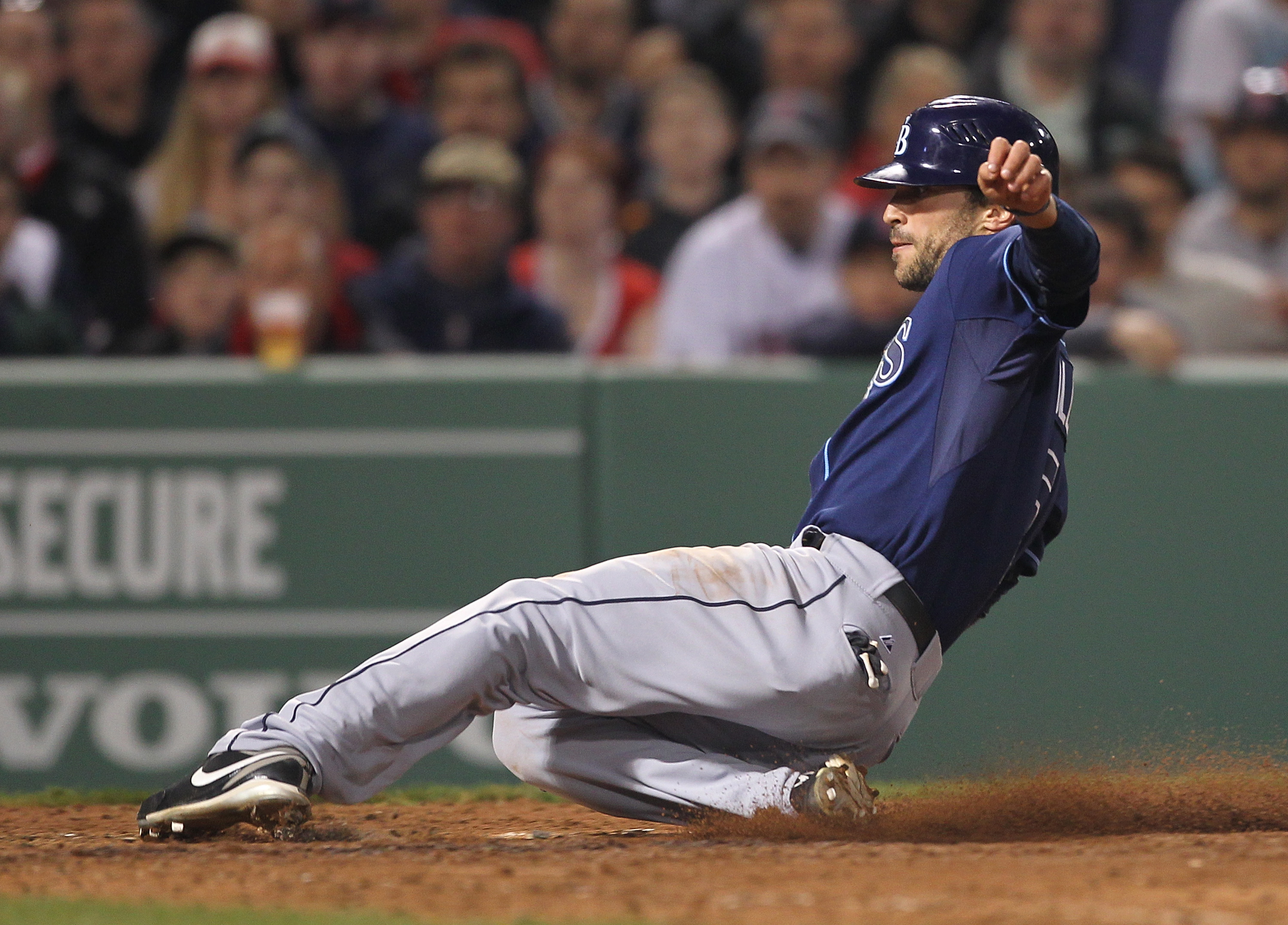 BOSTON, MA - APRIL 11:  Sam Fuld #5 of the Tampa Bay Rays scores on a wild pitch against the Boston Red Sox at Fenway Park April 11, 2011 in Boston, Massachusetts. (Photo by Jim Rogash/Getty Images)