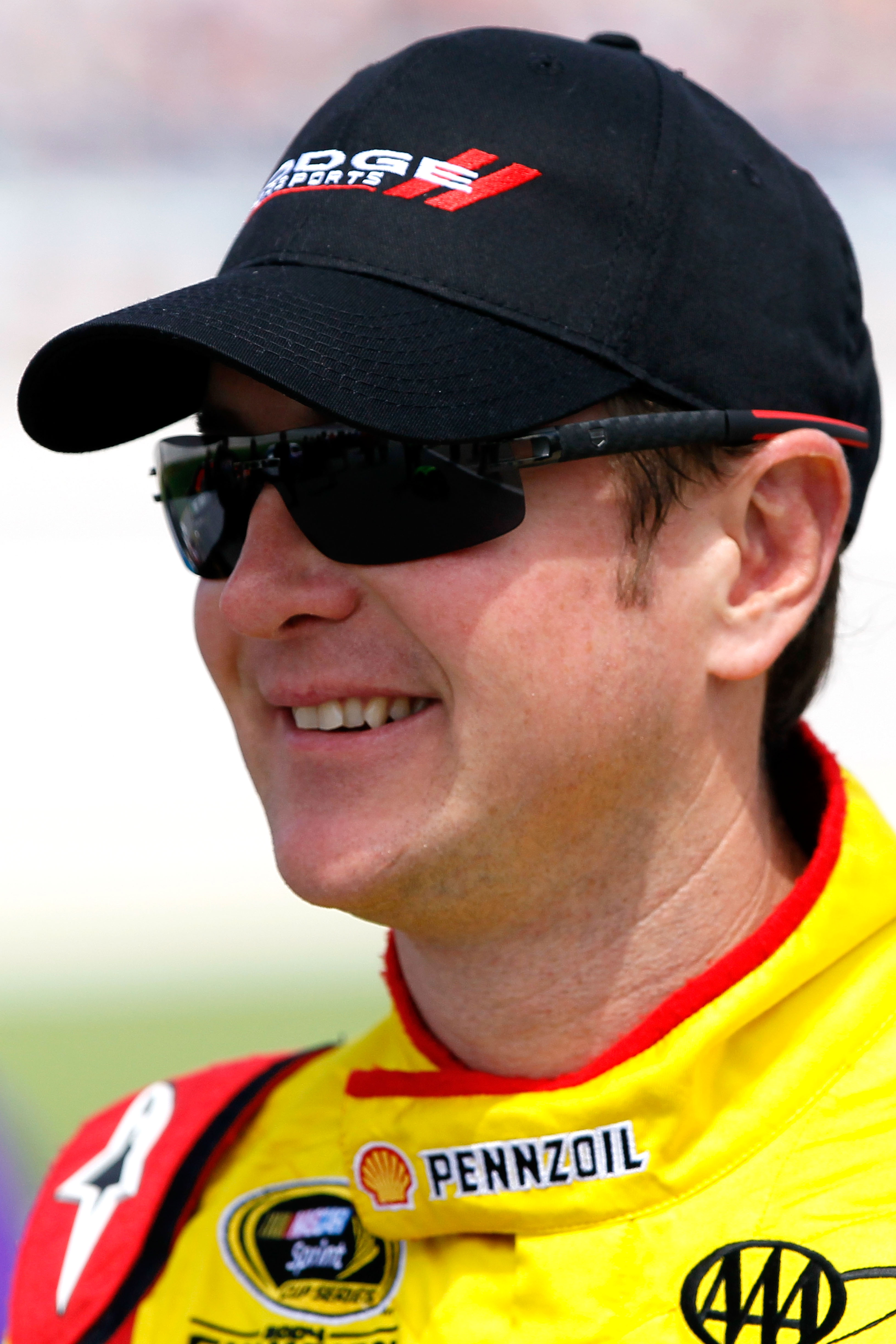 TALLADEGA, AL - APRIL 16:  Kurt Busch, driver of the #22 Shell/Pennzoil-AAA Dodge, walks on the grid during qualifying for the NASCAR Sprint Cup Series Aaron's 499 at Talladega Superspeedway on April 16, 2011 in Talladega, Alabama.  (Photo by Kevin C. Cox