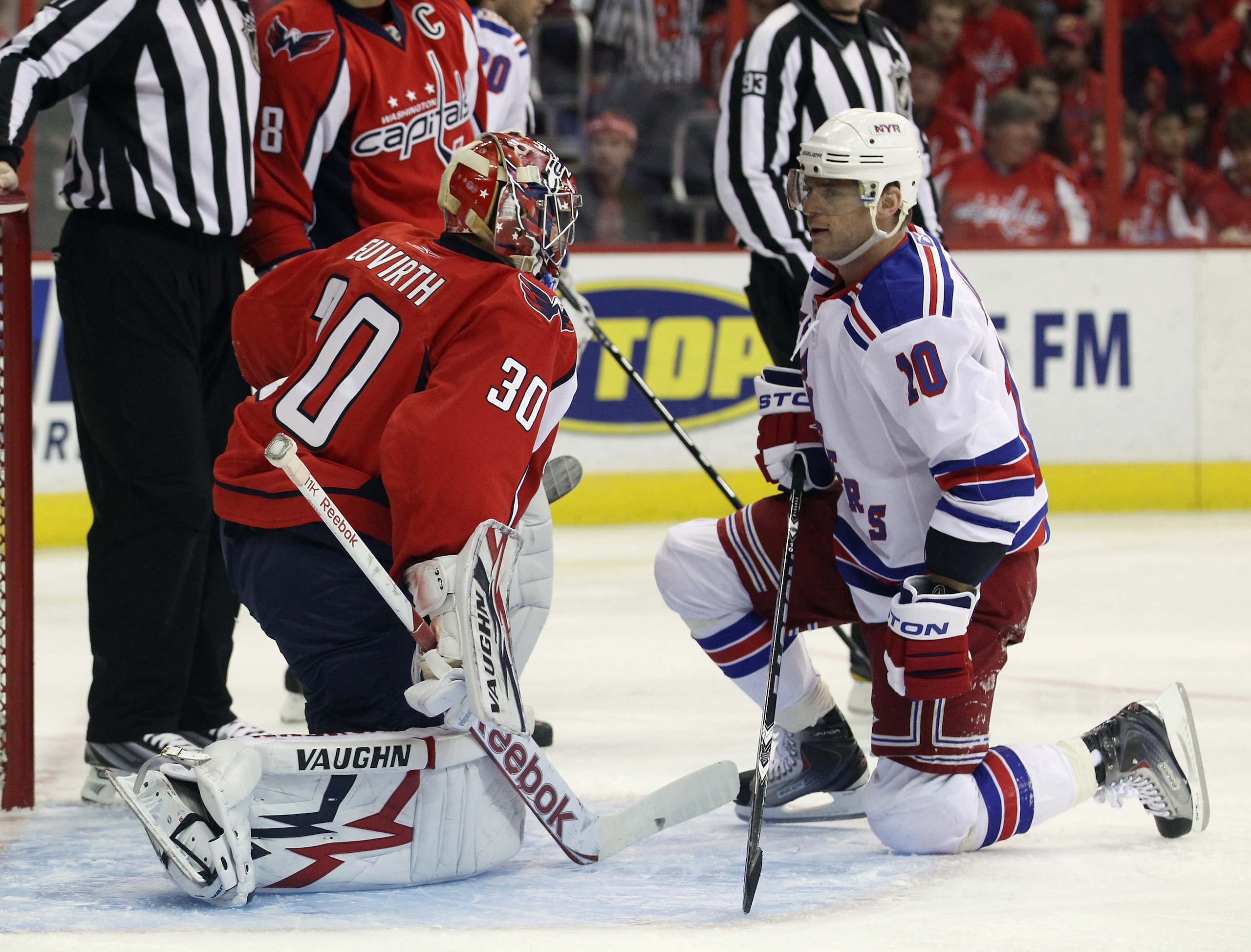 WASHINGTON, DC - APRIL 15: Michal Neuvirth #30 of the Washington Capitals and Marian Gaborik #10 of the New York Rangers exchange a few words during a play stoppage in the first period in Game Two of the Eastern Conference Quarterfinals during the 2011 NH