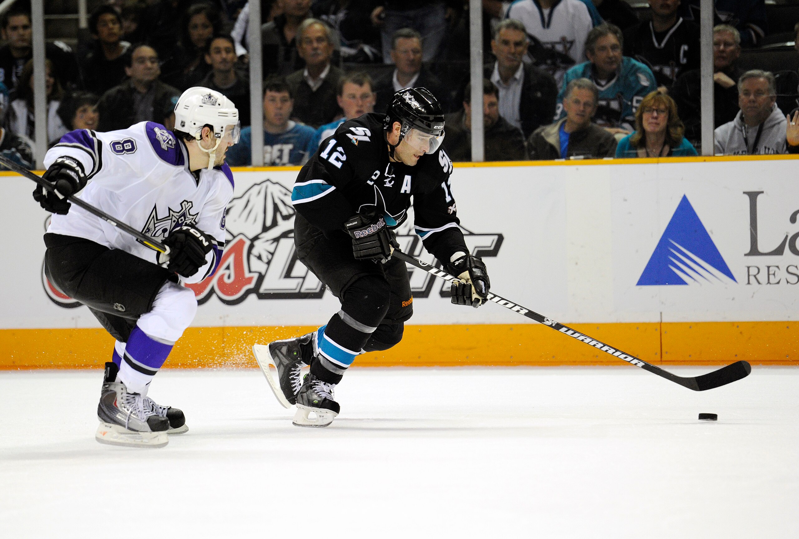 SAN JOSE, CA - APRIL 14: Patrick Marleau #12 of the San Jose Sharks, in overtime breaks away from Drew Doughty #8 of the Los Angeles Kings in Game One of the Western Conference Quarterfinals  during the 2011 NHL Stanley Cup Playoffs at the HP Pavilion on