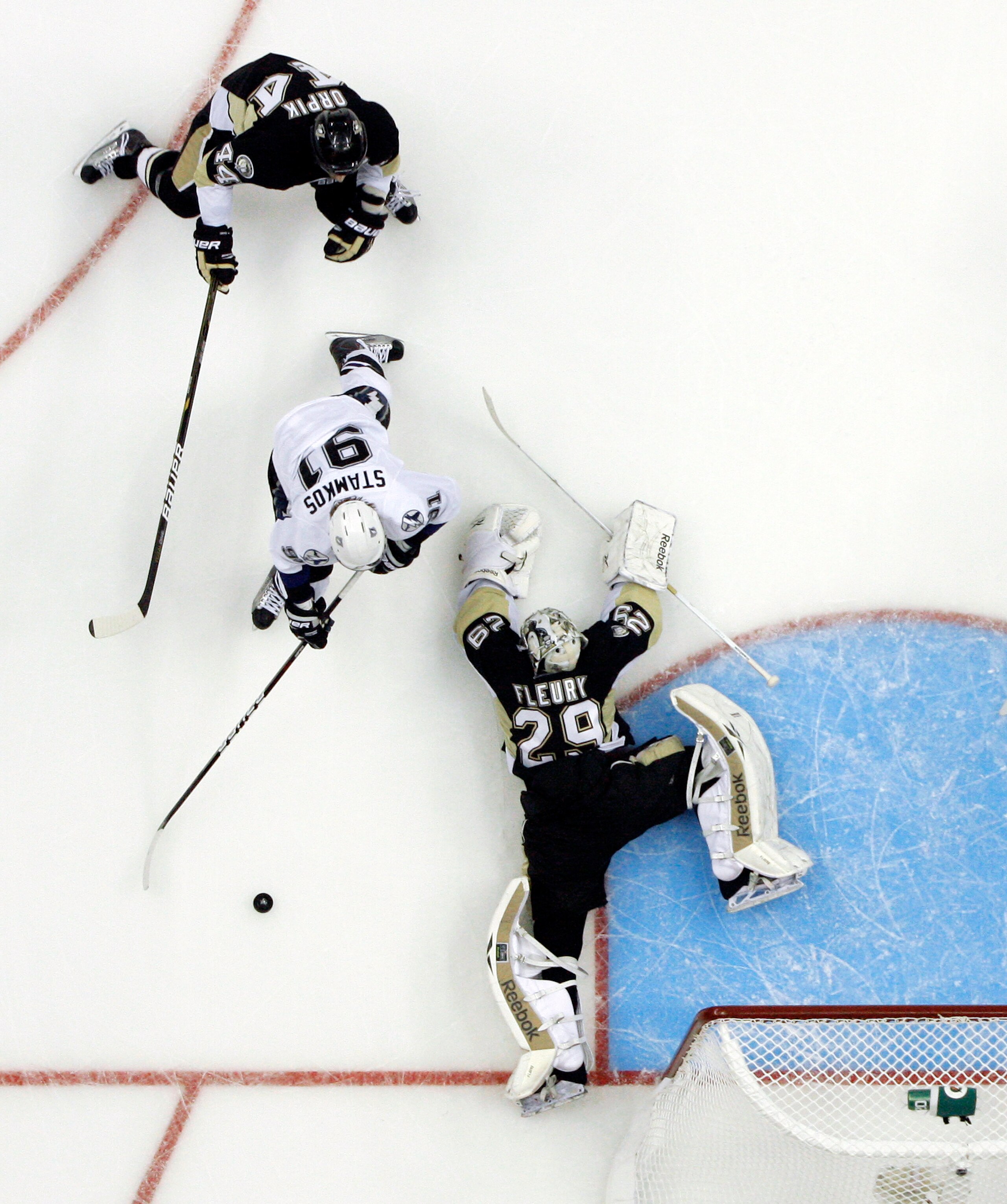 PITTSBURGH, PA - APRIL 15:  Marc-Andre Fleury #29 of the Pittsburgh Penguins makes a save on Steven Stamkos #91 of the Tampa Bay Lightning in Game Two of the Eastern Conference Quarterfinals during the 2011 NHL Stanley Cup Playoffs at Consol Energy Center