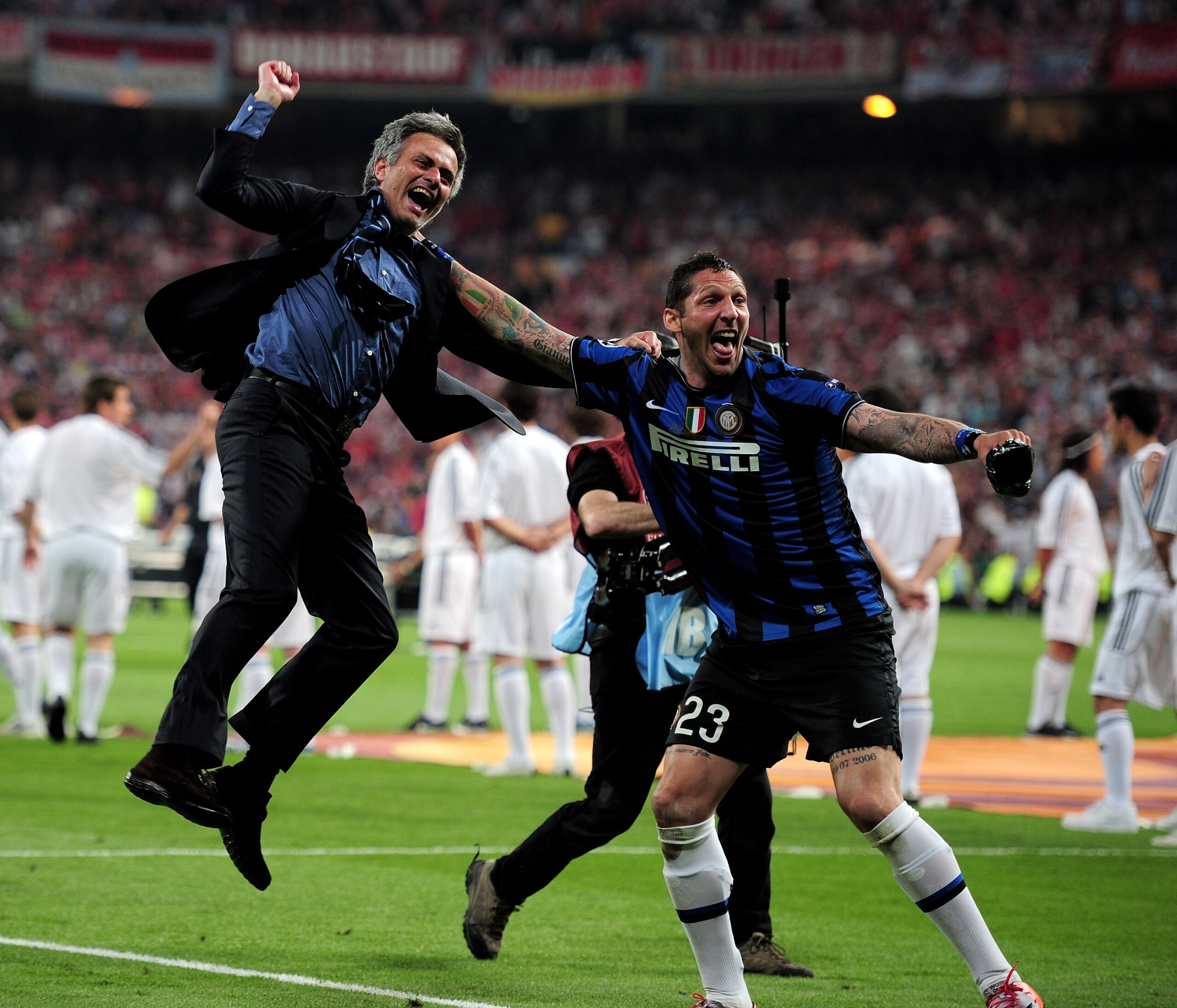 MADRID, SPAIN - MAY 22: Head coach Jose Mourinho (L) and Marco Materazzi of Inter Milan celebrate their team's victory at the end of the UEFA Champions League Final match between FC Bayern Muenchen and Inter Milan at the Estadio Santiago Bernabeu on May MADRID, SPAIN - MAY 22: Head coach Jose Mourinho (L) and Marco Materazzi of Inter Milan celebrate their team's victory at the end of the UEFA Champions League Final match between FC Bayern Muenchen and Inter Milan at the Estadio Santiago Bernabeu on May