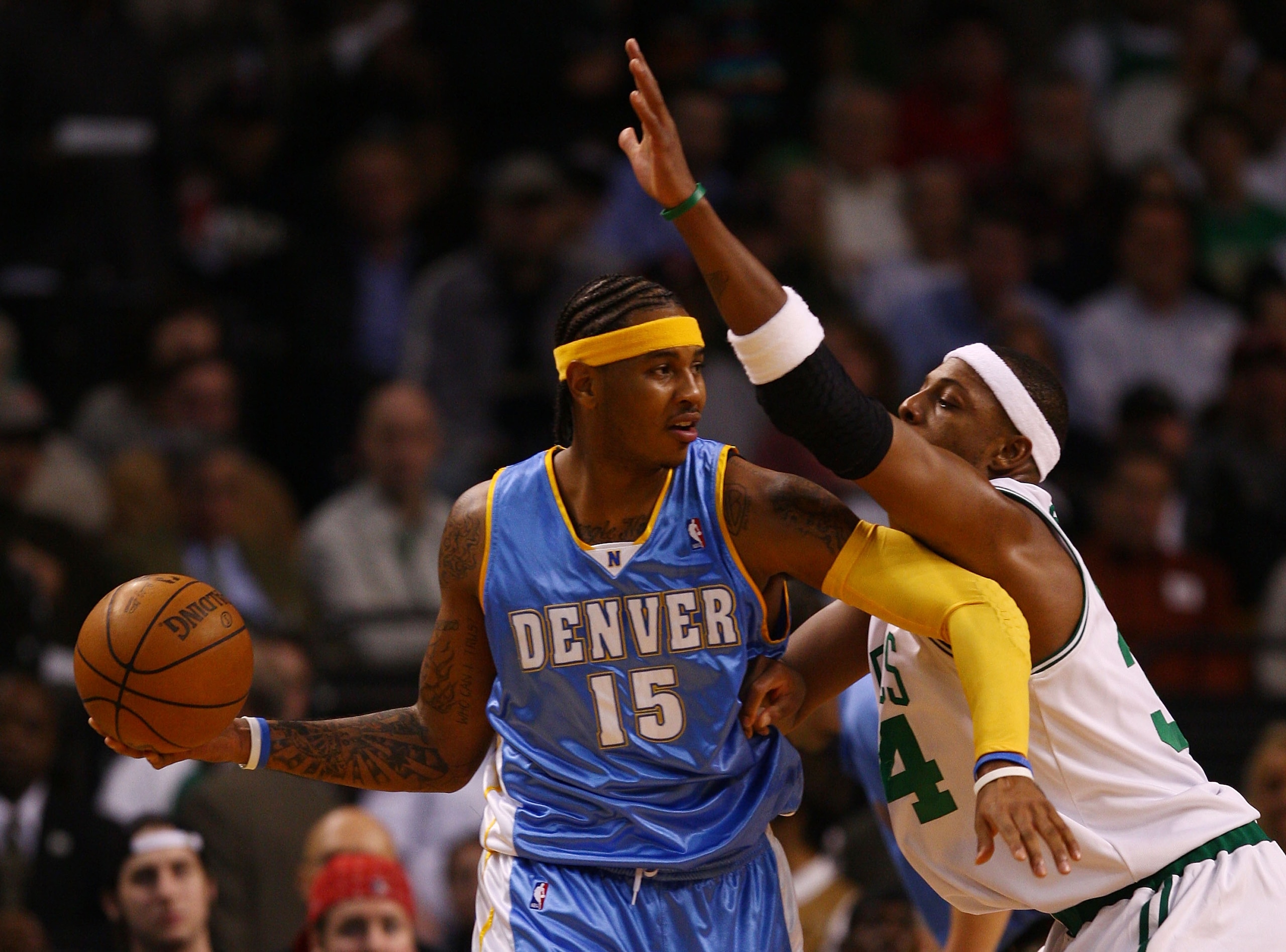 BOSTON - NOVEMBER 07: Carmelo Anthony #15 of the Denver Nuggets looks to pass as Paul Pierce #34 of the Boston Celtics defends on November 7, 2007 at the TD Banknorth Garden in Boston, Massachusetts. NOTE TO USER: User expressly acknowledges and agrees BOSTON - NOVEMBER 07: Carmelo Anthony #15 of the Denver Nuggets looks to pass as Paul Pierce #34 of the Boston Celtics defends on November 7, 2007 at the TD Banknorth Garden in Boston, Massachusetts. NOTE TO USER: User expressly acknowledges and agrees