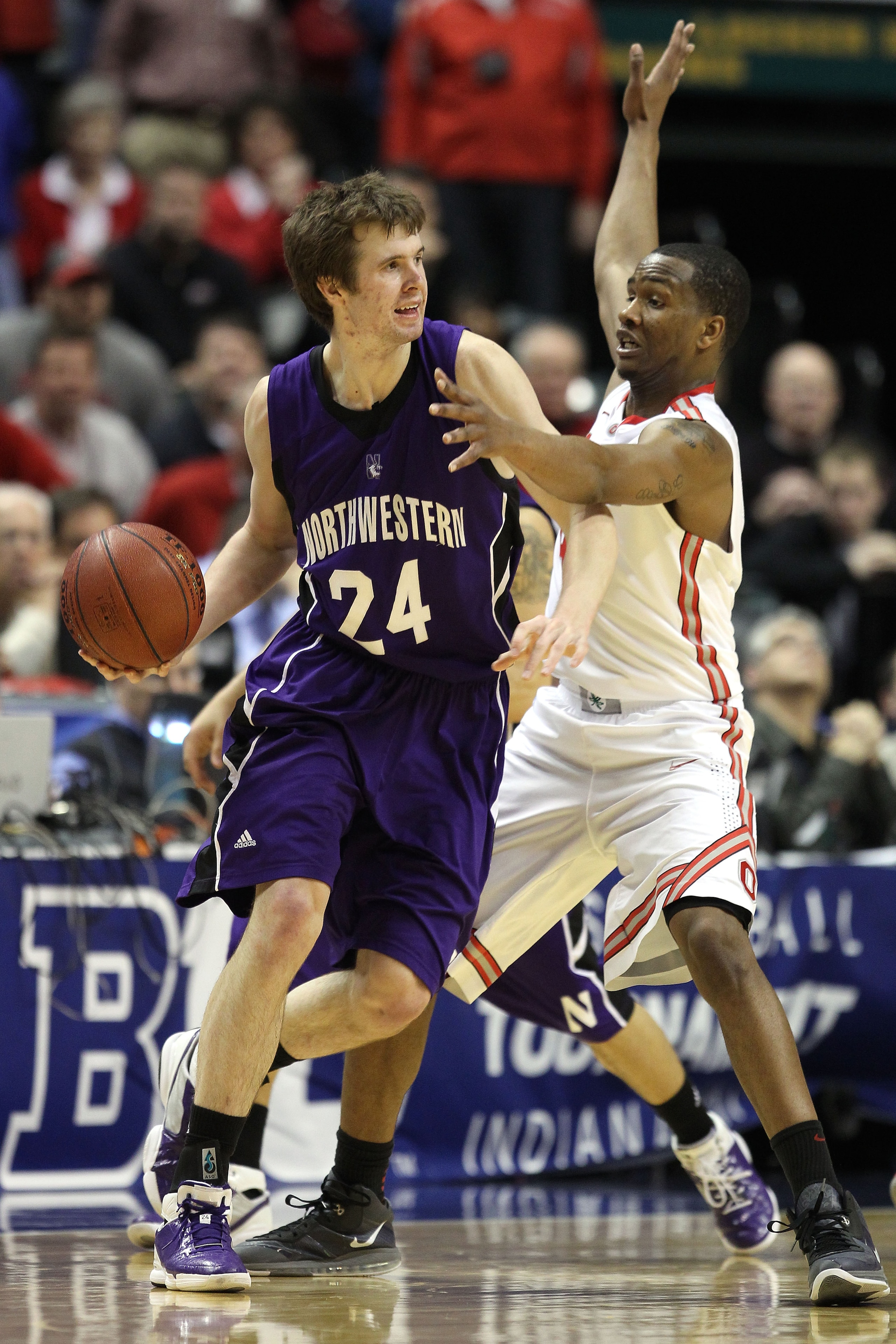 INDIANAPOLIS, IN - MARCH 11:  John Shurna #24 of the Northwestern Wildcats looks to pass against the William Buford #44 of the Ohio State Buckeyes during the quarterfinals of the 2011 Big Ten Men's Basketball Tournament at Conseco Fieldhouse on March 11,