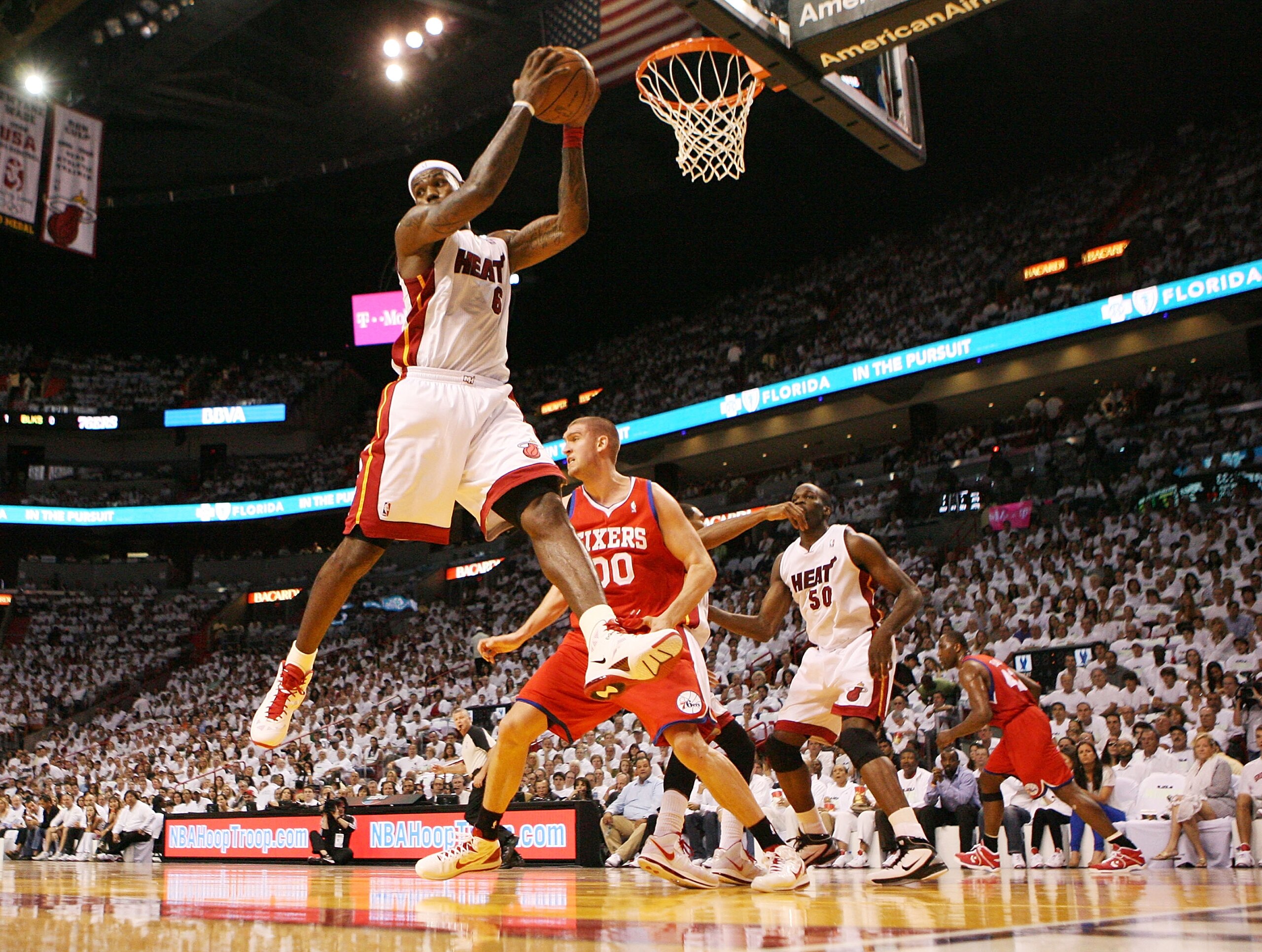 MIAMI, FL - APRIL 16: Forward LeBron James #6 of the Miami Heat rebounds against the Philadelphia 76ers at the American Airlines Arena in game one of the Eastern Conference Quarterfinals in the 2011 NBA Playoffs on April 16, 2011 in Miami, Florida. NOTE T