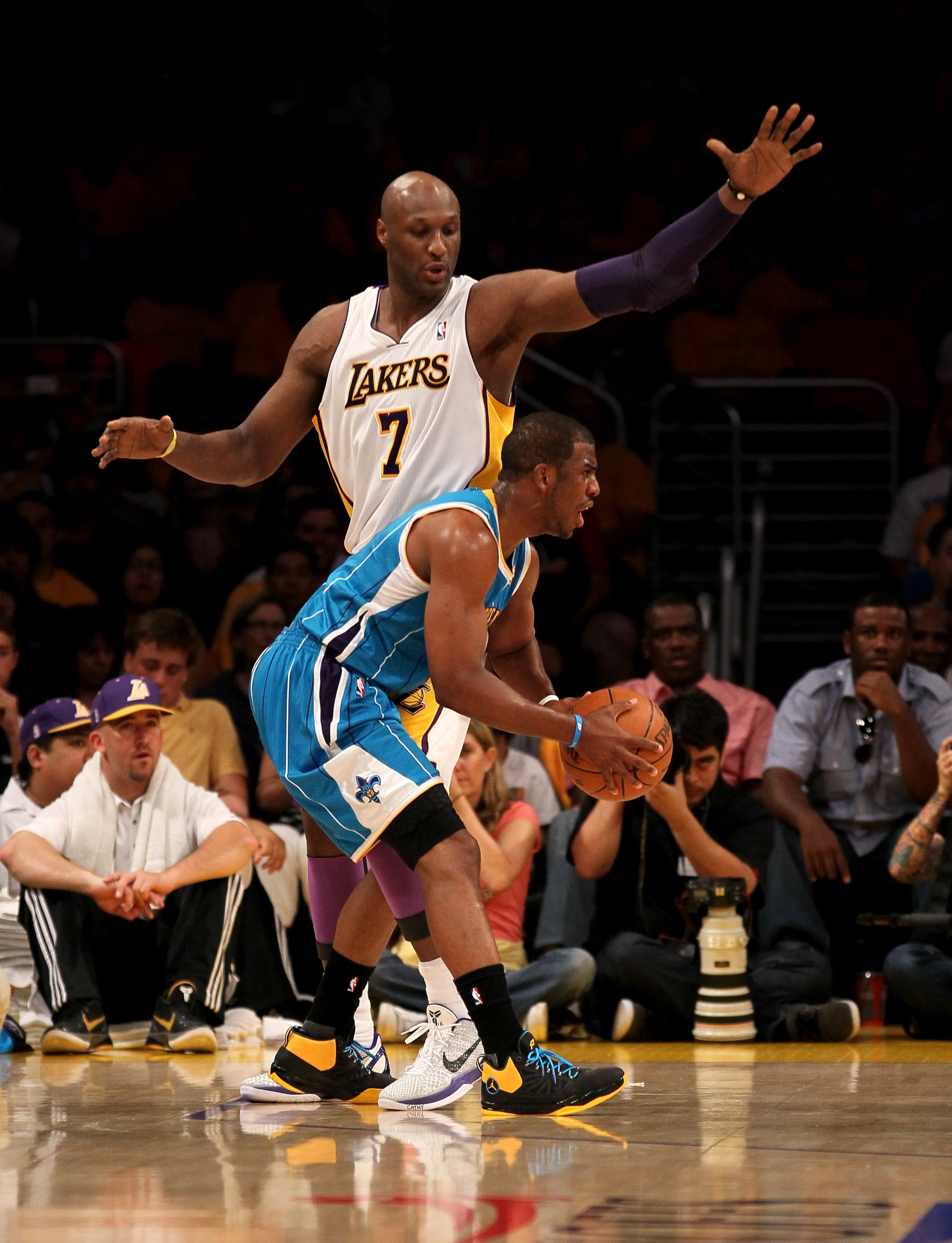 LOS ANGELES, CA - APRIL 17:  Chris Paul #3 of  the New Orleans Hornets controls the ball against Lamar Odom #7 of the Los Angeles Lakers in Game One of the Western Conference Quarterfinals in the 2011 NBA Playoffs on April 17, 2011 at Staples Center in Lo