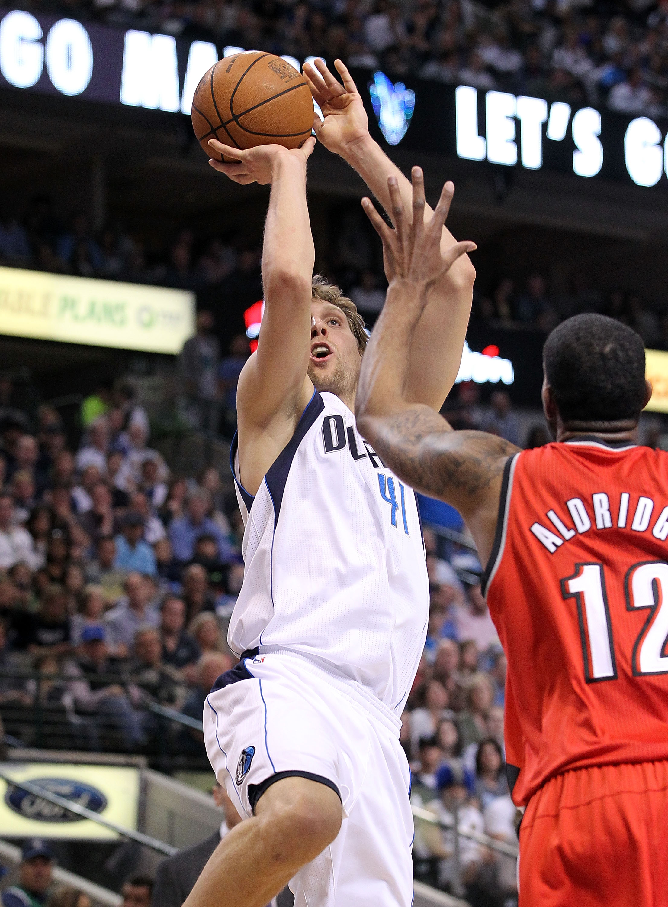 DALLAS, TX - APRIL 16:  Forward Dirk Nowitzki #41 of the Dallas Mavericks takes a shot against LaMarcus Aldridge #12 of the Portland Trail Blazers in Game One of the Western Conference Quarterfinals during the 2011 NBA Playoffs on April 16, 2011 at Americ