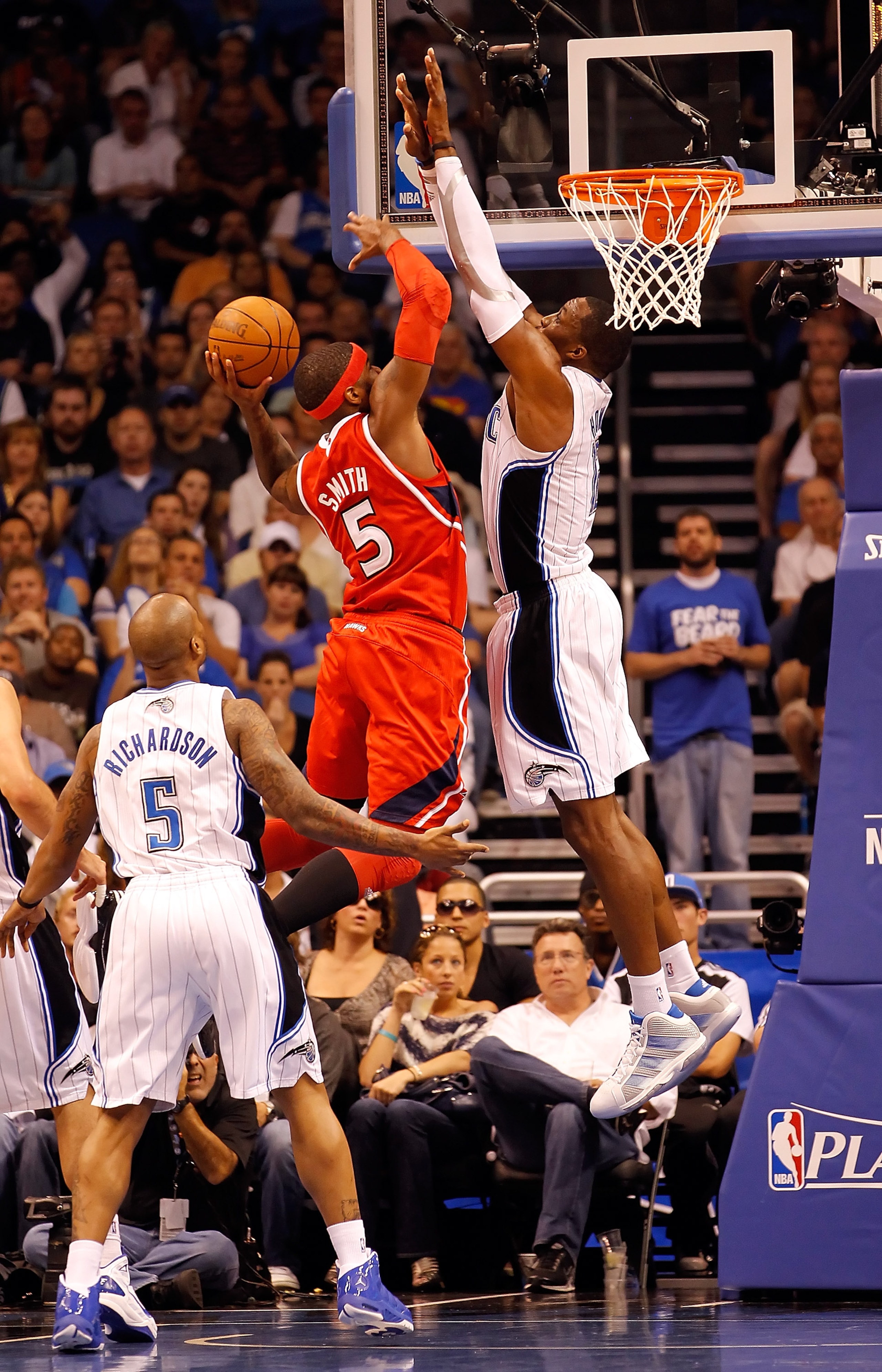 ORLANDO, FL - APRIL 16:  Josh Smith #5 of the Atlanta Hawks drives to the basket as Dwight Howard #12 of the Orlando Magic defends during Game One of the Eastern Conference Quarterfinals of the 2011 NBA Playoffs on April 16, 2011 at the Amway Arena in Orl