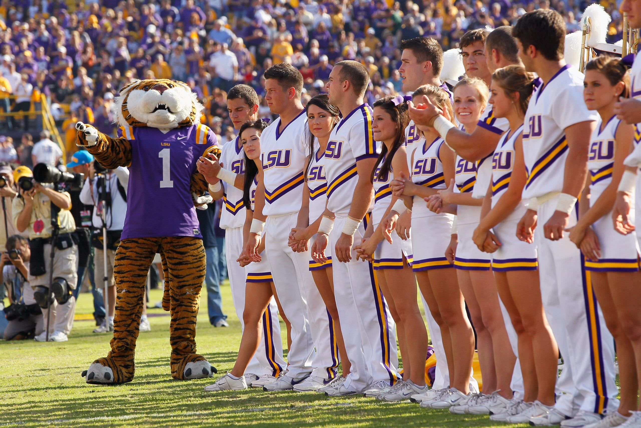 BATON ROUGE, LA - NOVEMBER 20:  Mike the Tiger and the cheerleaders of the Louisiana State University Tigers cheer before facing the Ole Miss Rebels at Tiger Stadium on November 20, 2010 in Baton Rouge, Louisiana.  (Photo by Kevin C. Cox/Getty Images)
