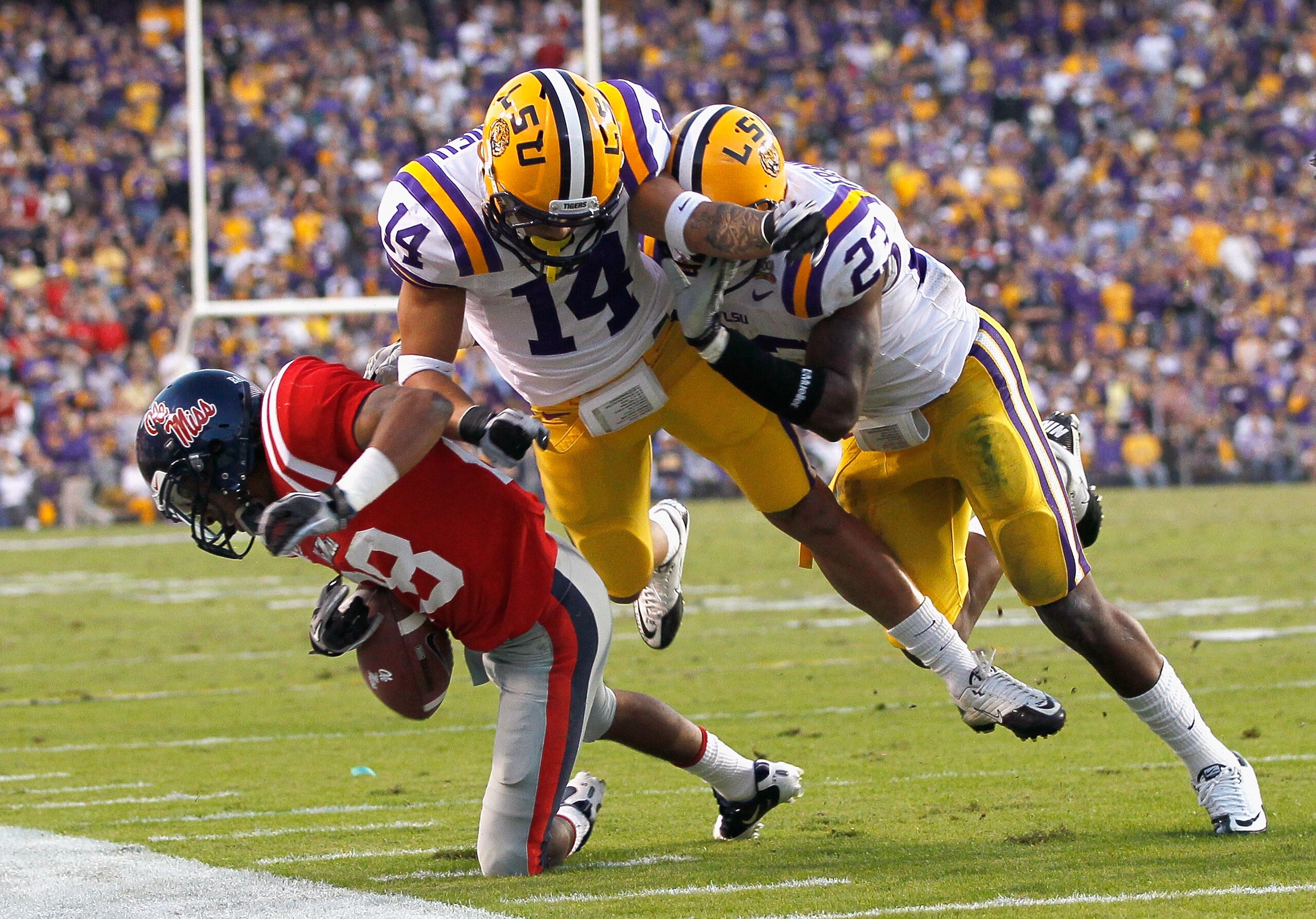 BATON ROUGE, LA - NOVEMBER 20:  Tyrann Mathieu #14 of the Louisiana State University Tigers is called for a helmet-to-helmet contact penalty after hitting Korvic Neat #28 of the Ole Miss Rebels at Tiger Stadium on November 20, 2010 in Baton Rouge, Louisia