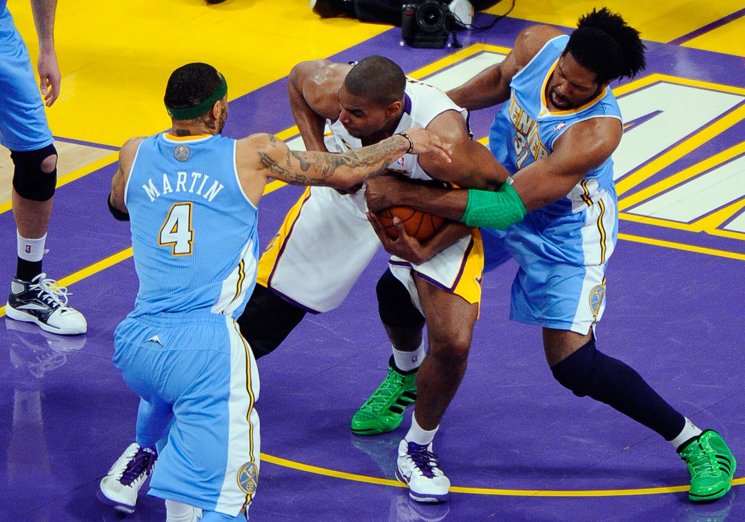 LOS ANGELES, CA - APRIL 03: Kenyon Martin #4 and Nene #31 of the Denver Nuggets surround Andrew Bynum #17 of the Los Angeles Lakers during the game at Staples Center on April 3, 2011 in Los Angeles, California. NOTE TO USER: User expressly acknowledges a LOS ANGELES, CA - APRIL 03: Kenyon Martin #4 and Nene #31 of the Denver Nuggets surround Andrew Bynum #17 of the Los Angeles Lakers during the game at Staples Center on April 3, 2011 in Los Angeles, California. NOTE TO USER: User expressly acknowledges a