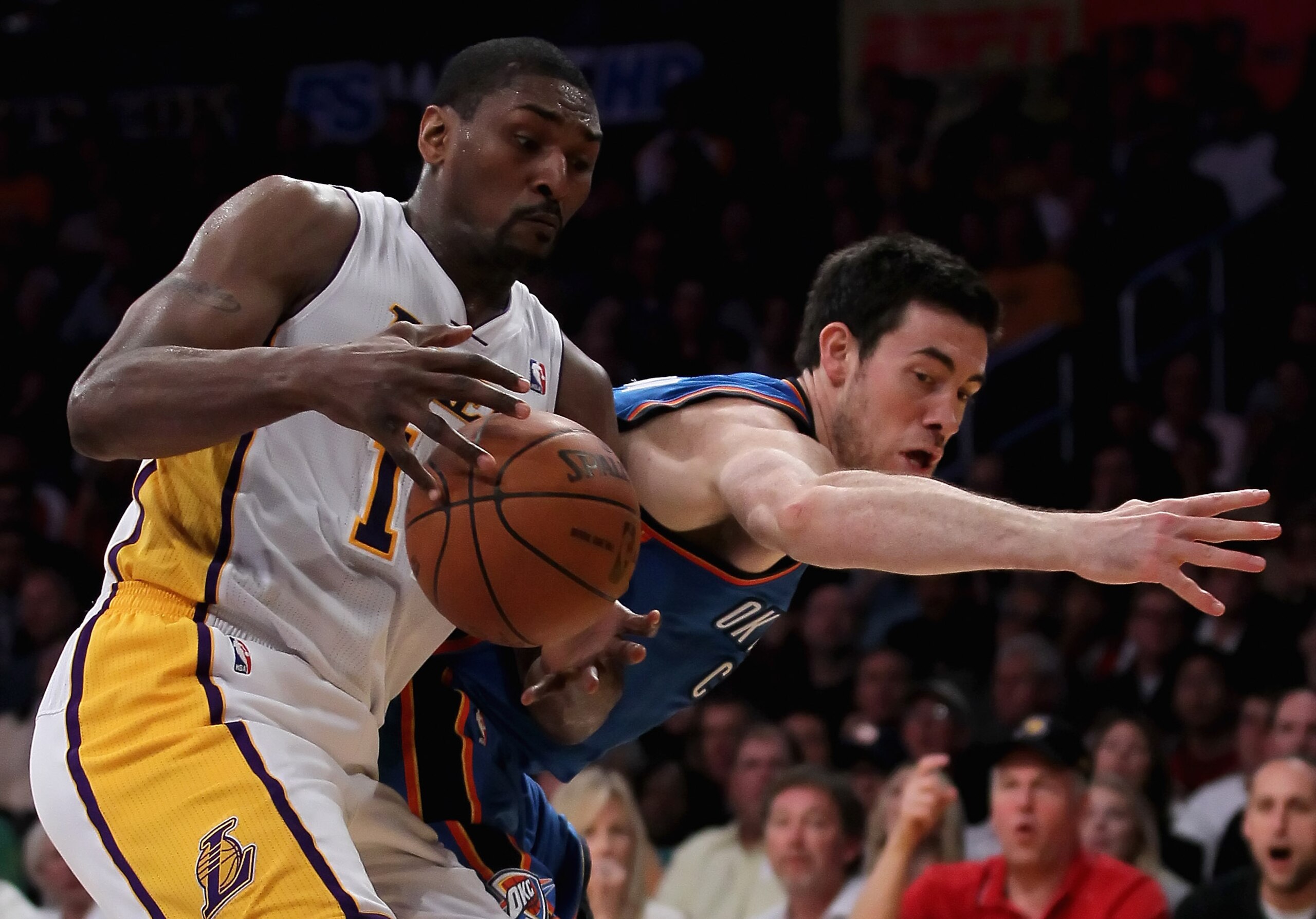 LOS ANGELES, CA - APRIL 10: Nick Collison #4 of the Oklahoma City Thunder attempts to steal the ball from Ron Artest #15 of the Los Angeles Lakers in the first half at Staples Center on April 10, 2011 in Los Angeles, California. The Thunder defeated the LOS ANGELES, CA - APRIL 10: Nick Collison #4 of the Oklahoma City Thunder attempts to steal the ball from Ron Artest #15 of the Los Angeles Lakers in the first half at Staples Center on April 10, 2011 in Los Angeles, California. The Thunder defeated the