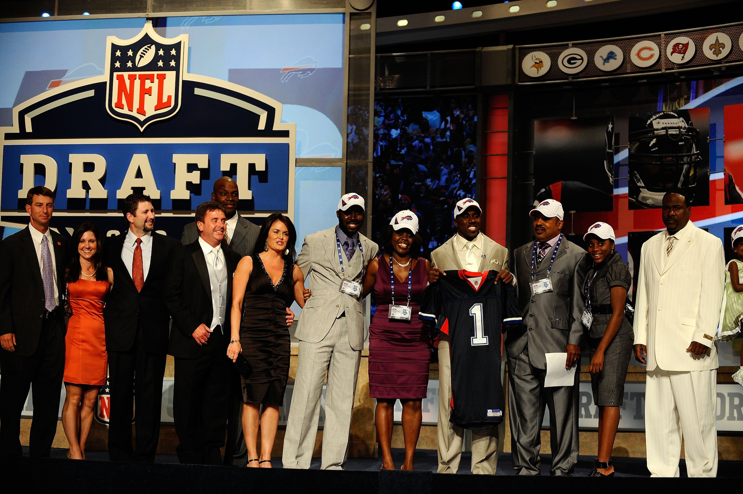 NEW YORK - APRIL 22: C.J. Spiller from the Clemson Tigers holds up a Buffalo Bills jersey as he poses with friends and family after he was selected number 9 overall by the Bills during the first round of the 2010 NFL Draft at Radio City Music Hall on Apr NEW YORK - APRIL 22: C.J. Spiller from the Clemson Tigers holds up a Buffalo Bills jersey as he poses with friends and family after he was selected number 9 overall by the Bills during the first round of the 2010 NFL Draft at Radio City Music Hall on Apr