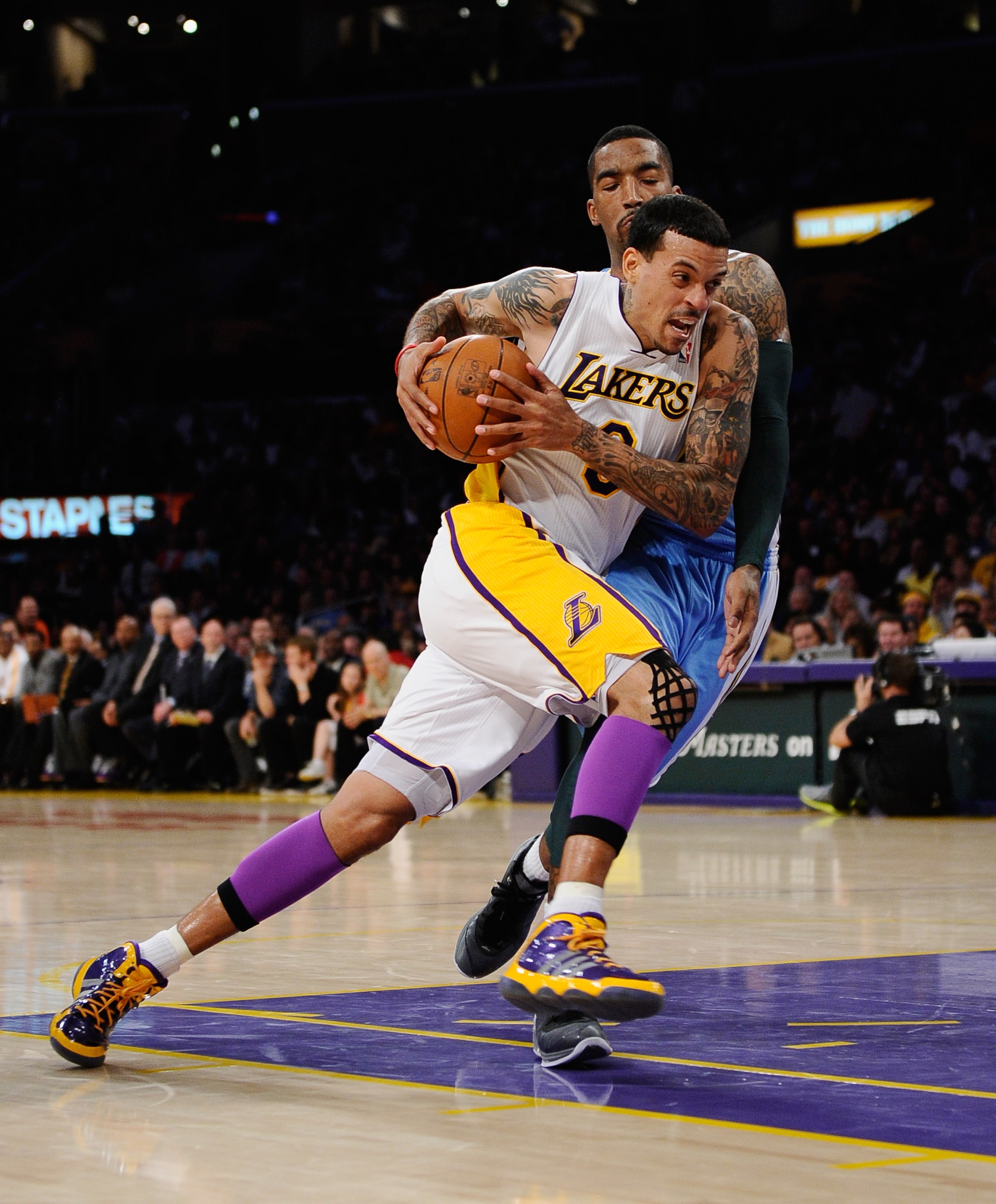 LOS ANGELES, CA - APRIL 03:  Matt Barnes #9 of the Los Angeles Lakers drives against JR Smith #5 of the Denver Nuggets at Staples Center on April 3, 2011 in Los Angeles, California. NOTE TO USER: User expressly acknowledges and agrees that, by downloading