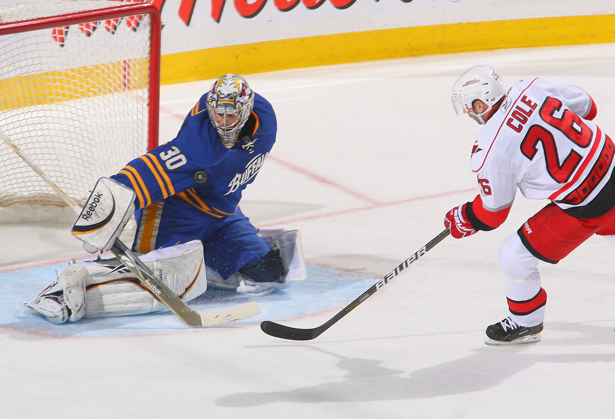 BUFFALO, NY - MARCH 15: Ryan Miller #30 of the Buffalo Sabres makes a save on a breakaway by Erik Cole #26 of the Carolina Hurricanes at HSBC Arena on March 15, 2011 in Buffalo, New York. Carolina won 1-0. (Photo by Rick Stewart/Getty Images)