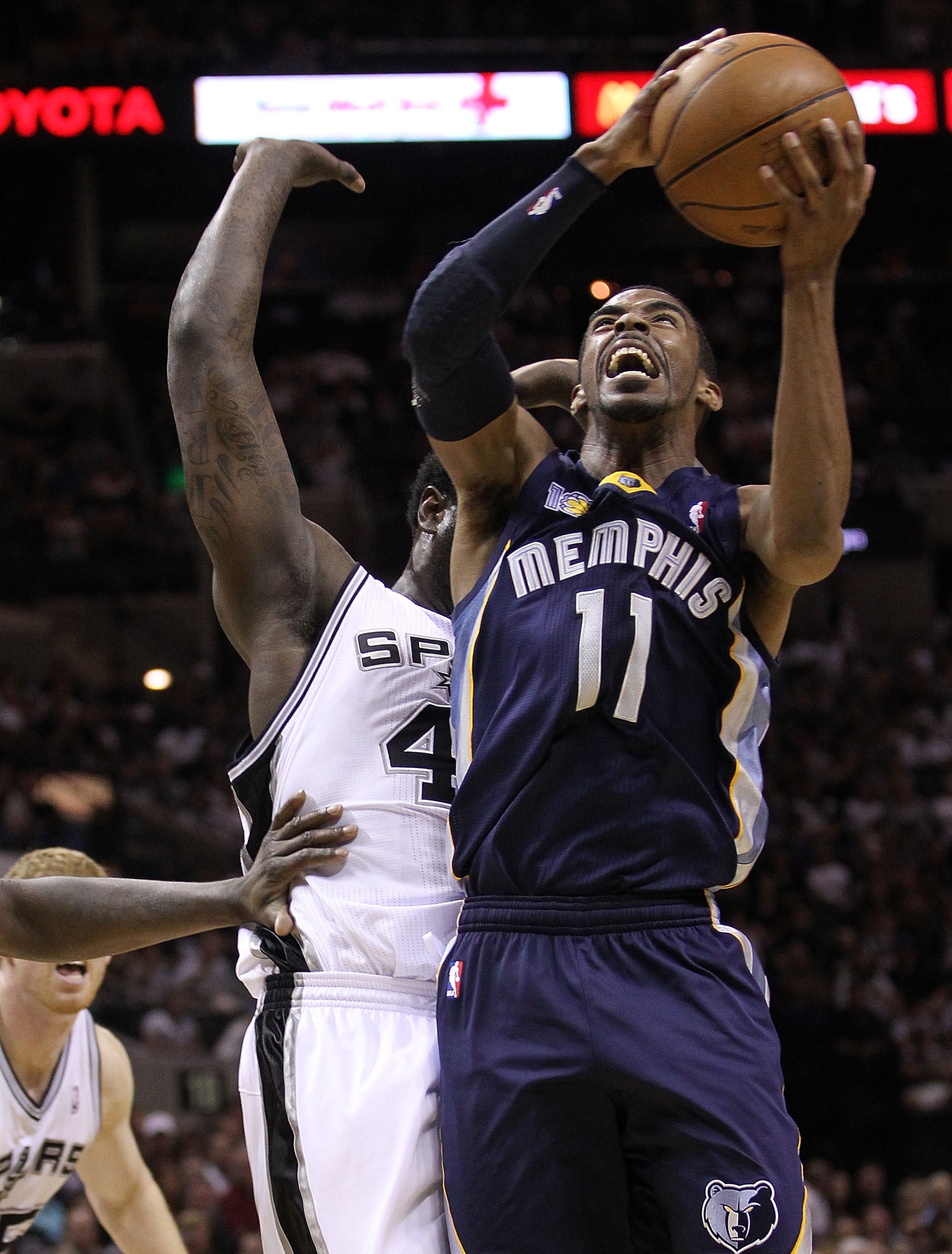 SAN ANTONIO, TX - APRIL 17:  Guard Mike Conley #11 of the Memphis Grizzlies takes a shot against DeJuan Blair #45 of the San Antonio Spurs in Game One of the Western Conference Quarterfinals in the 2011 NBA Playoffs on April 17, 2011 at AT&T Center in San