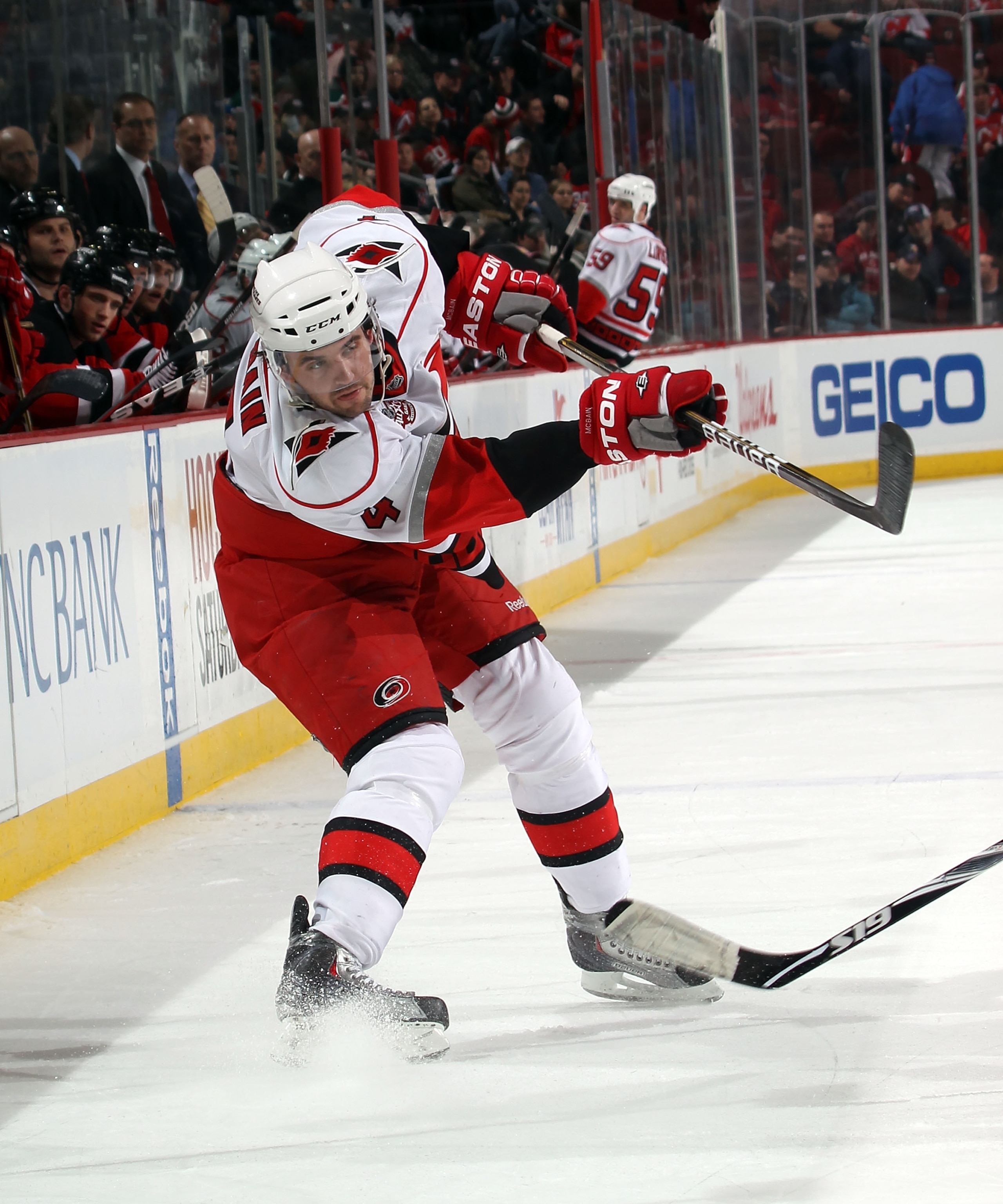 NEWARK, NJ - FEBRUARY 16: Jamie McBain #4 of the Carolina Hurricanes skates against the New Jersey Devils at the Prudential Center on February 16, 2011 in Newark, New Jersey.  (Photo by Bruce Bennett/Getty Images)