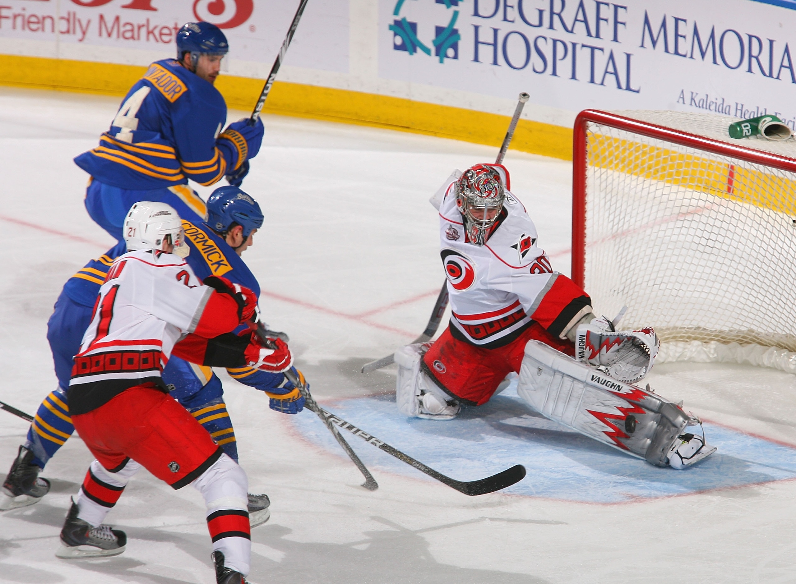 BUFFALO, NY - MARCH 15:  Goalie Cam Ward #30 of the Carolina Hurricanes makes a pad save on a shot by Cody McCormick #8 of the Buffalo Sabres  at HSBC Arena on March 15, 2011 in Buffalo, New York.  (Photo by Rick Stewart/Getty Images)